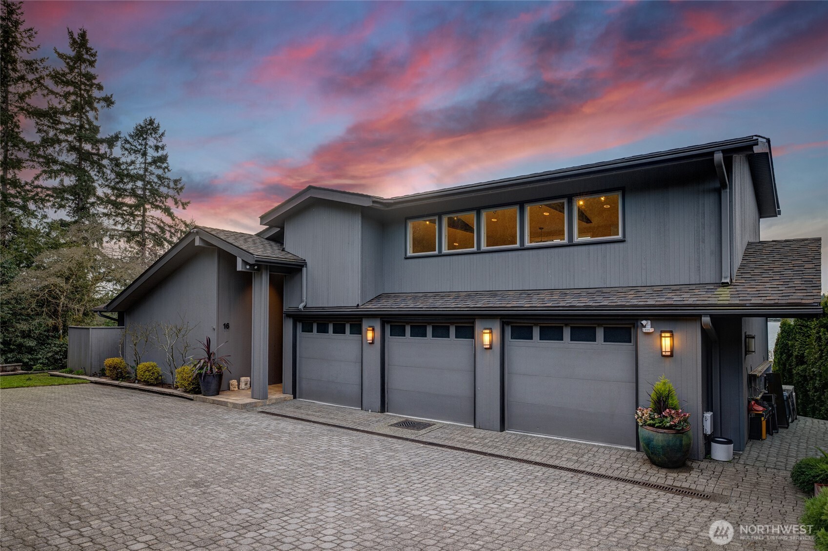 A gentle drive down Meadow Lane leads to this classic Northwest contemporary, welcoming you with a three car garage and easy, level entry.