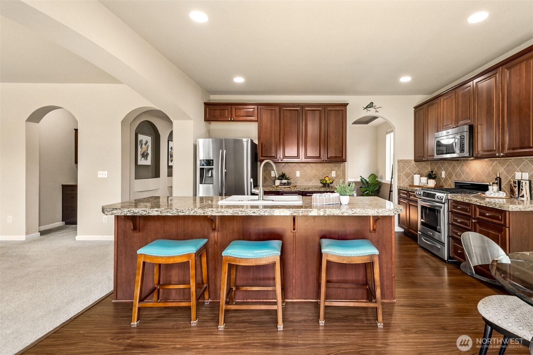 The center island with bar seating is so perfectly located