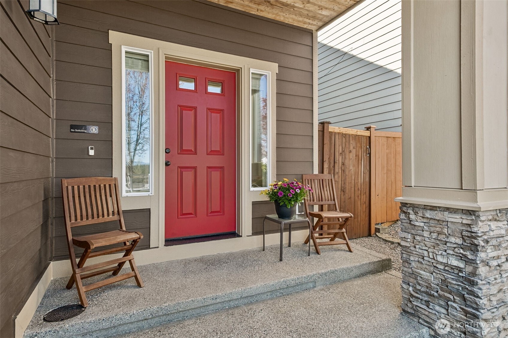We love this welcoming covered front porch! It's the perfect place for some peace, gazing across the street at the farm with the Cascade Mountain range in the background!