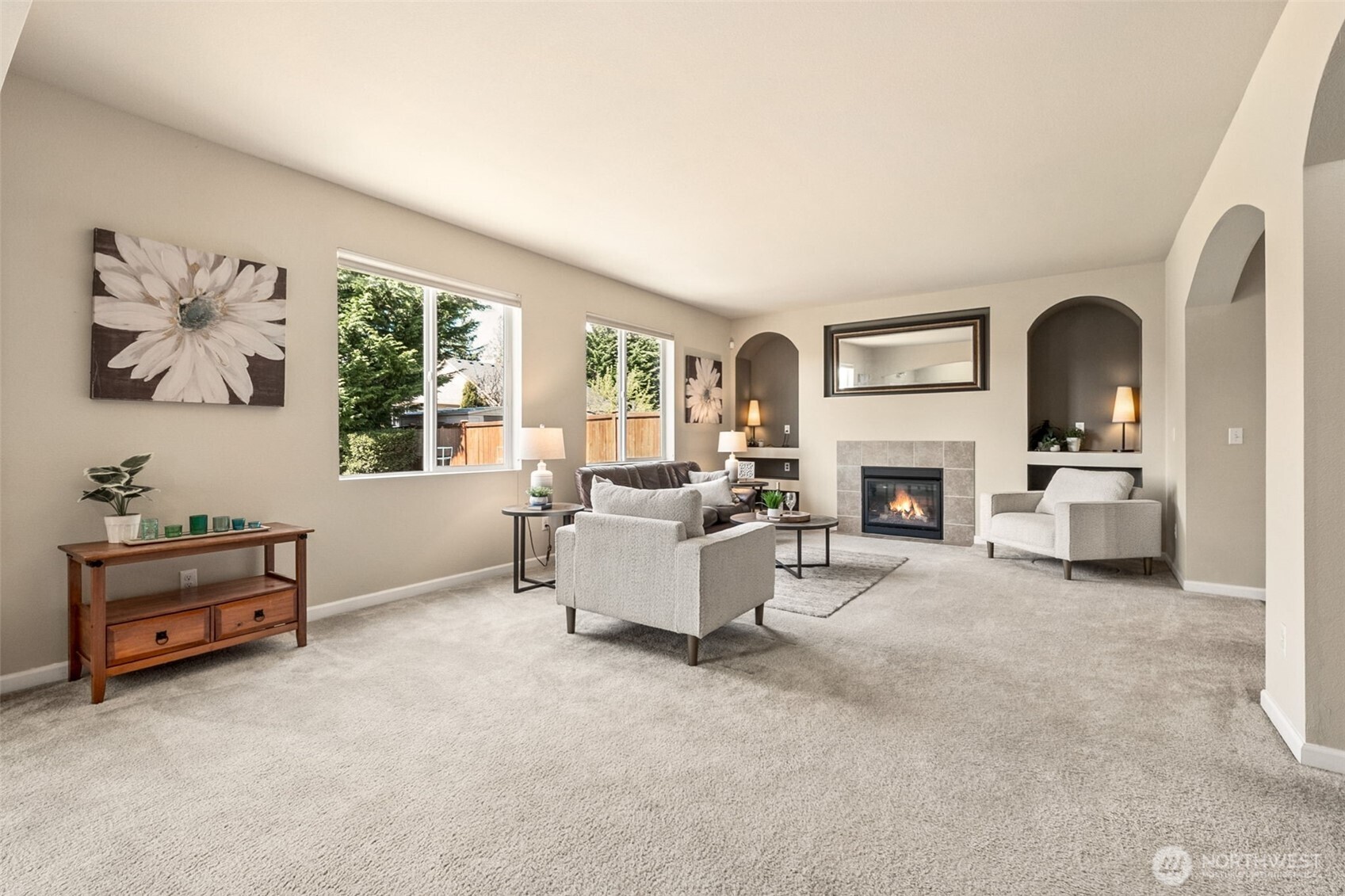 The natural daylight shines in through the large windows at the back of the house.