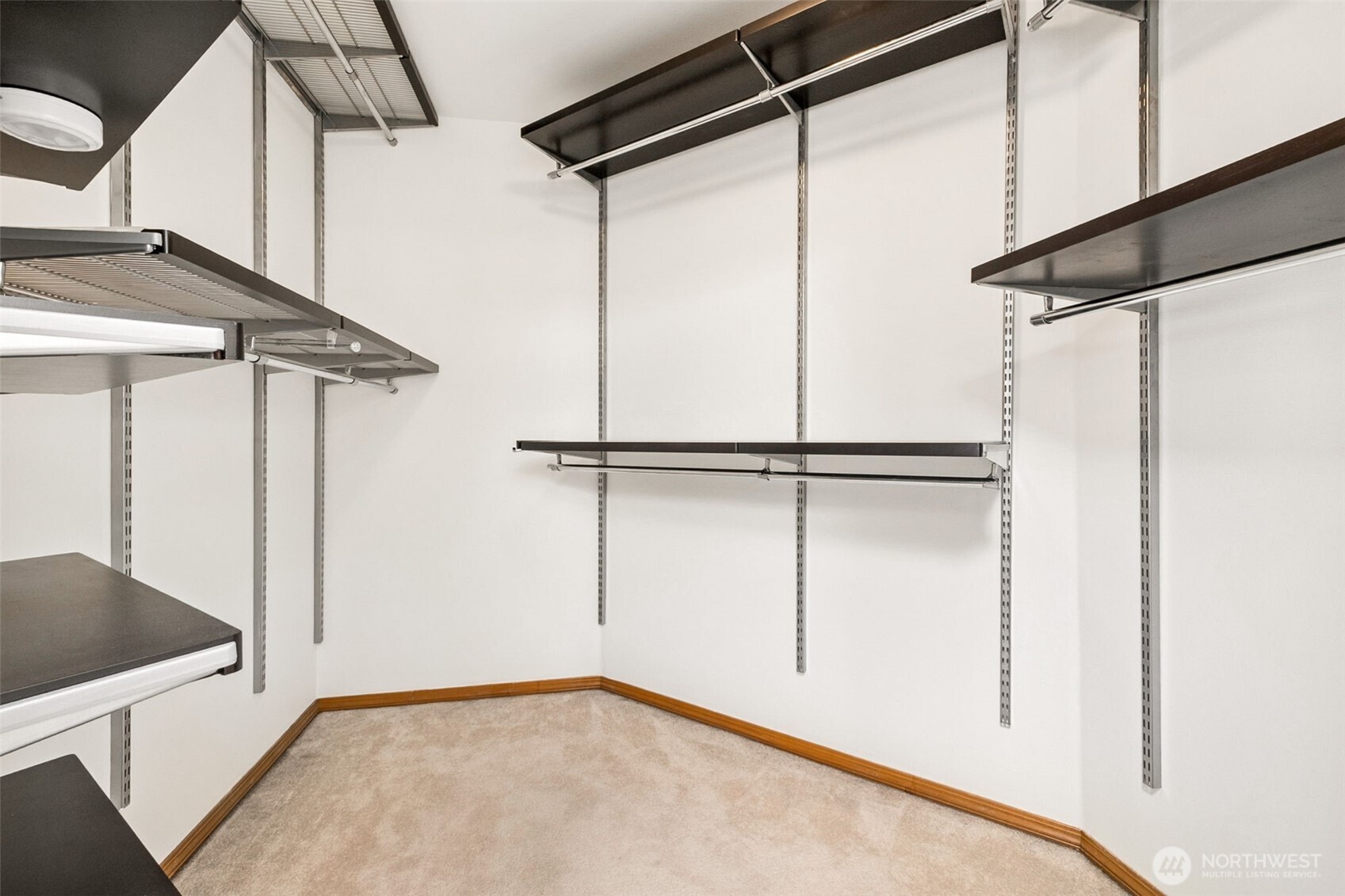 Primary suite large walk-in closet with built-in shelving!