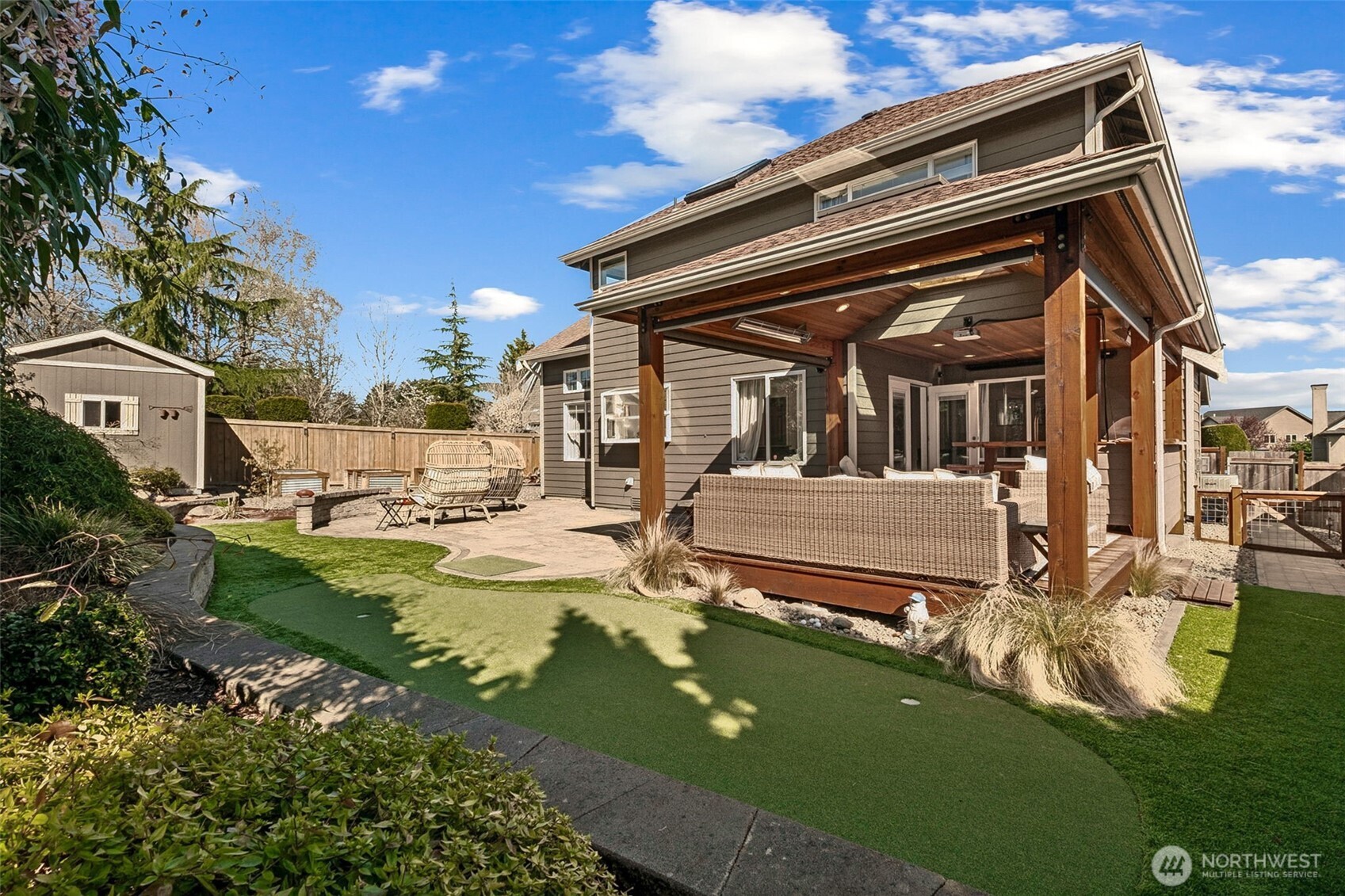 Exceptional . . . the surprising backyard is well integrated, and includes professional landscaping, irrigations system (serves front & back yards), paved walkways, built-in automatic outdoor lighting & more!