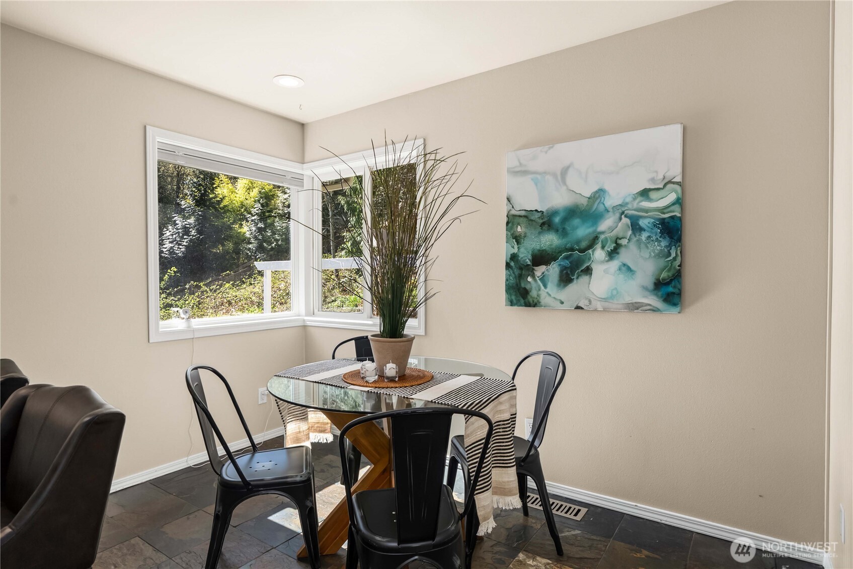 Stainless appliances add modern appeal. Off to the side is the walk in party with ample space.