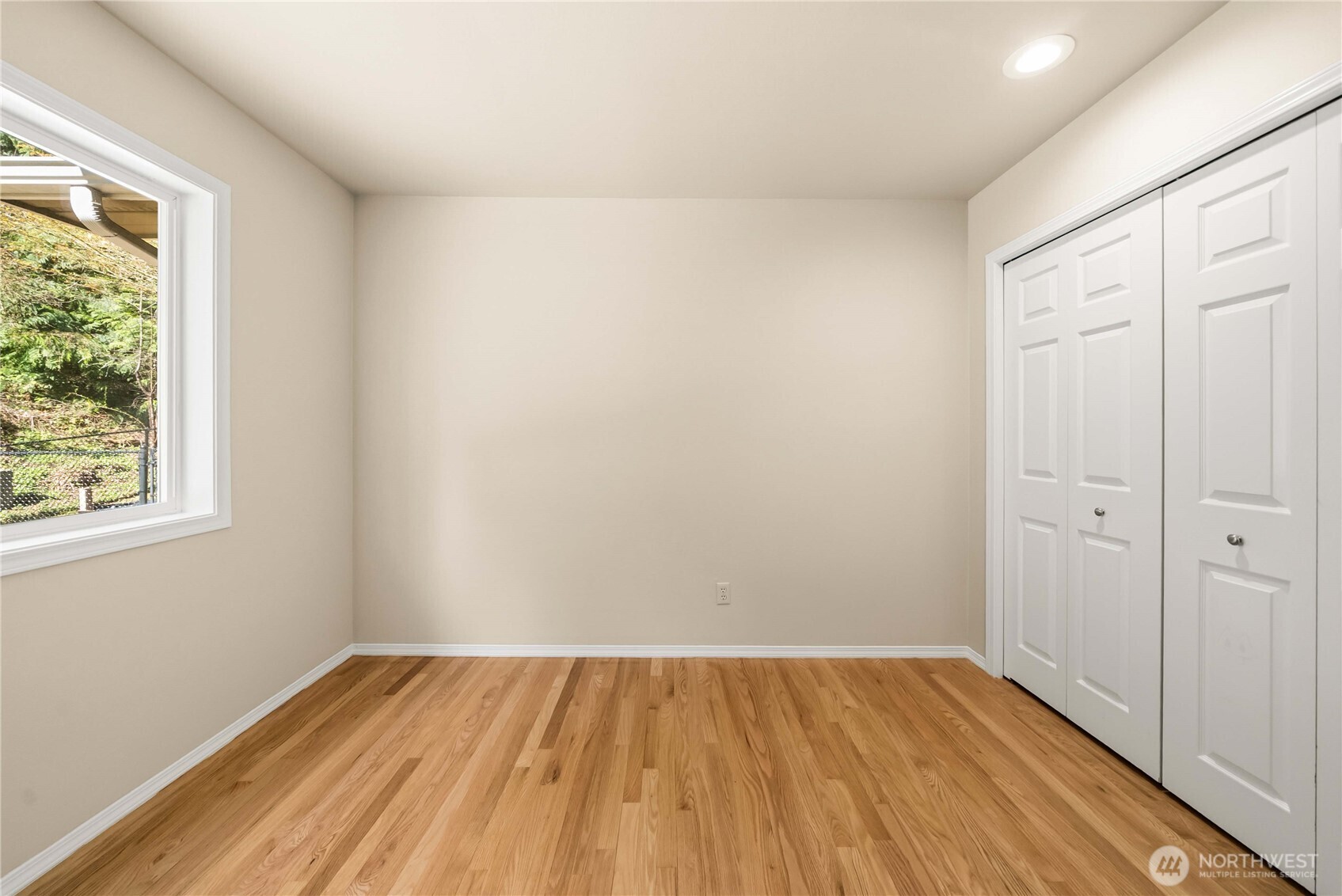 Light and airy secondary bedroom on the main floor.