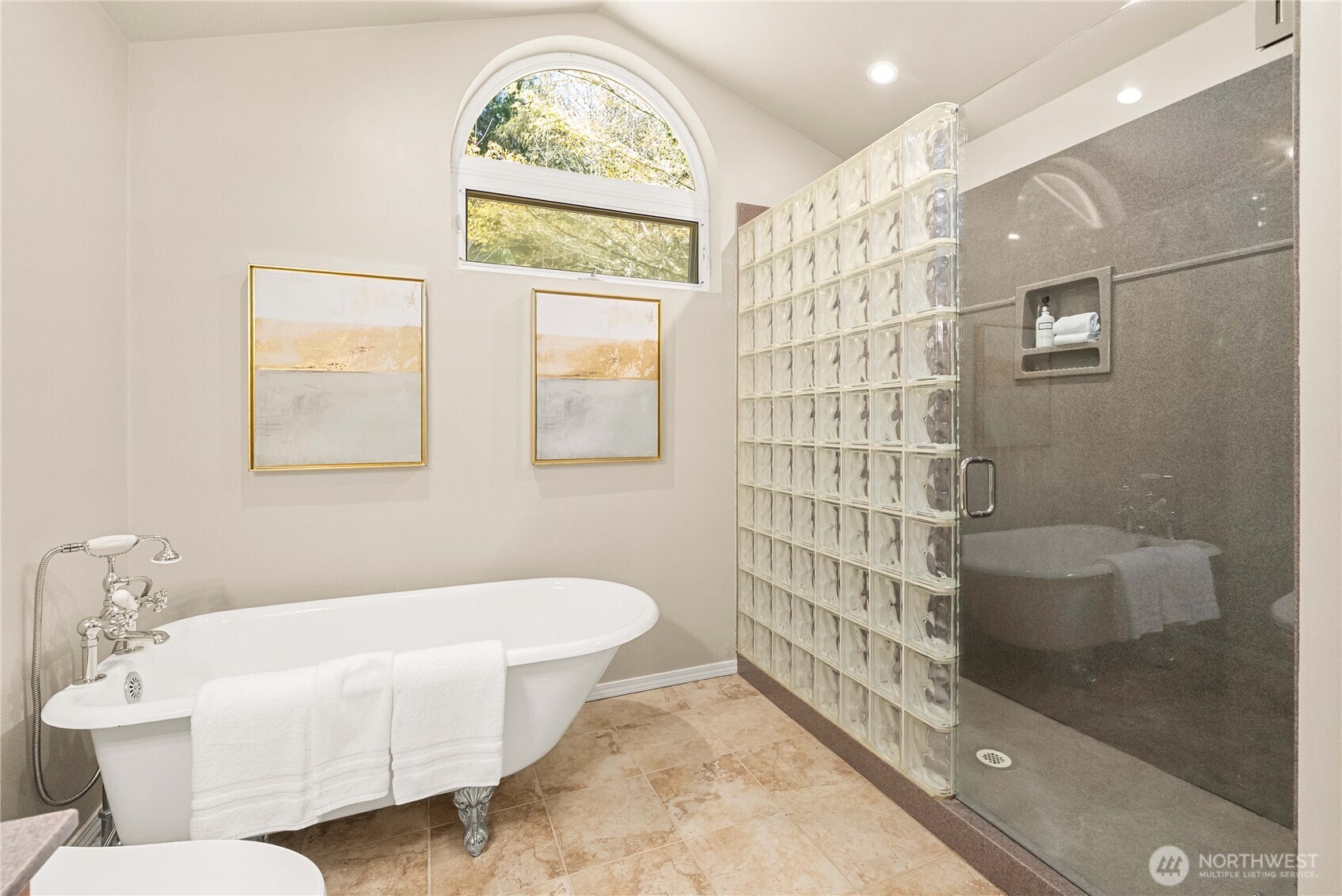 Spa-like en-suite bath with modern updates.