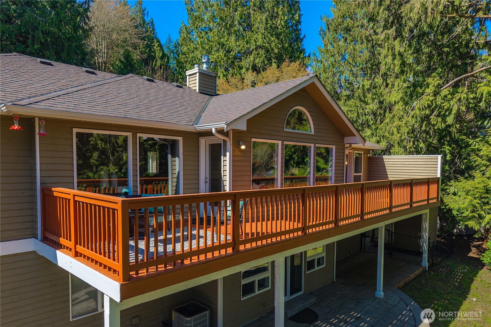 Private outdoor oasis surrounded by evergreens. Plenty of space for a garden.