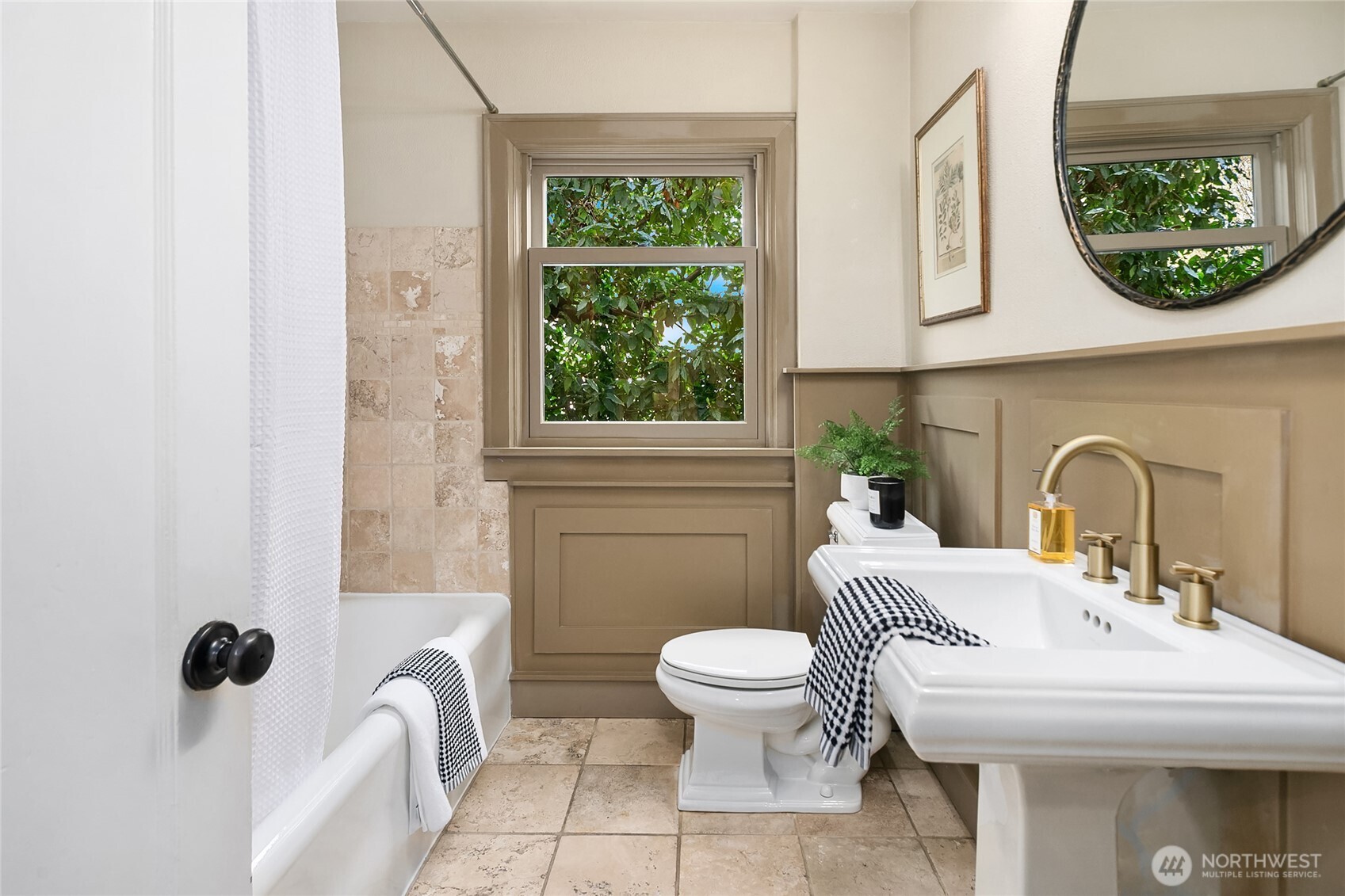 Full bath on main level.  There are two hall closets in this hallway to store linens and supplies.