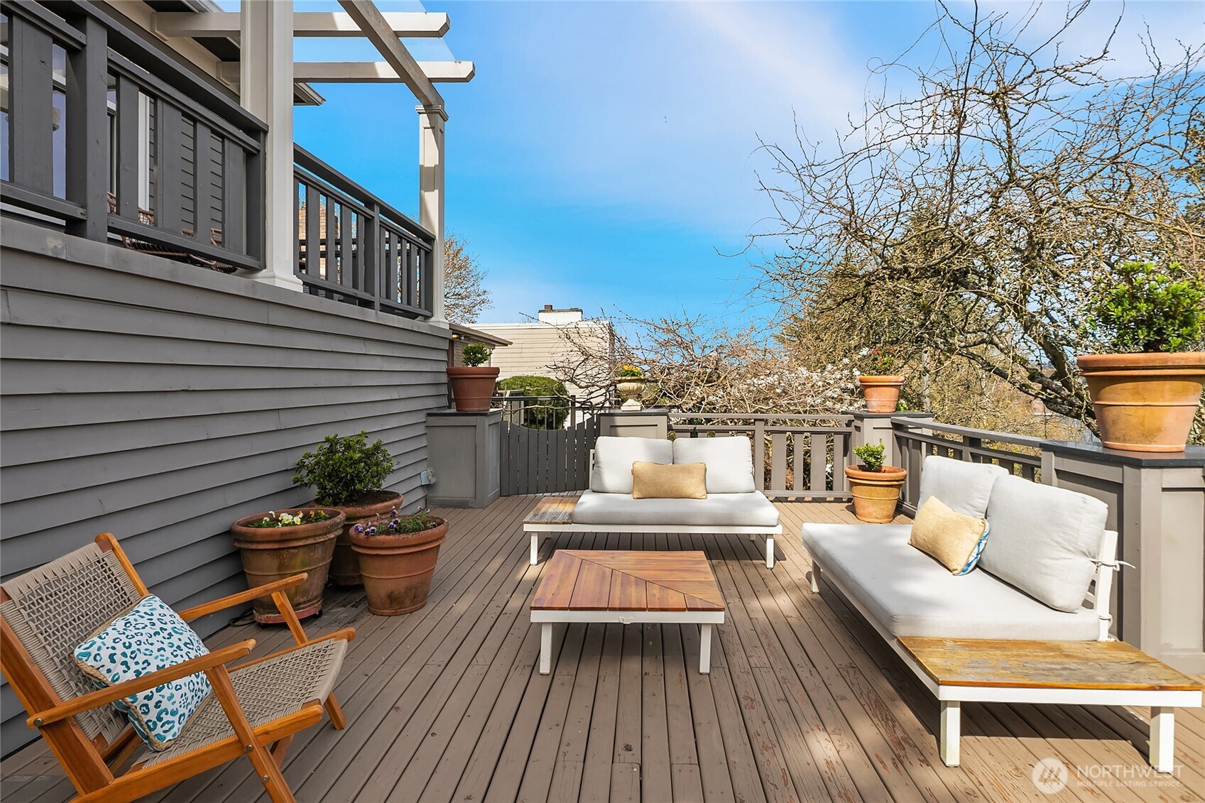 Expansive deck at the front of the home captures morning sun.