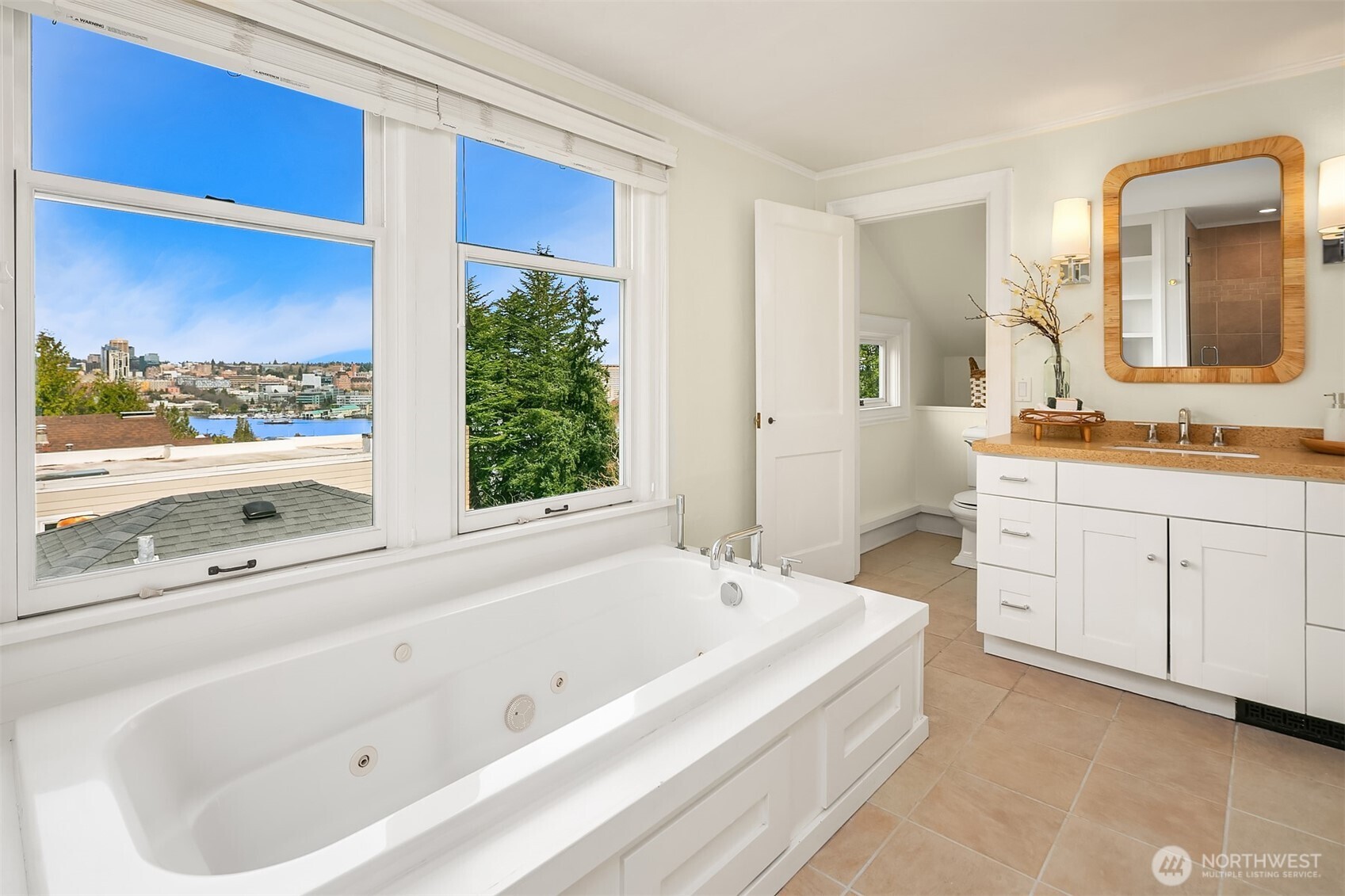 Primary ensuite bathroom with soaking tub, separate shower, vanity and W/C.