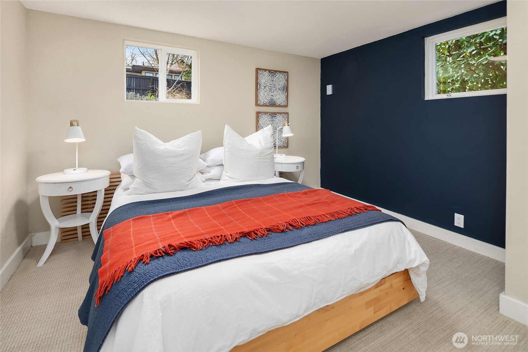 Lower level has high ceilings and a 5th bedroom with adjacent full bath.