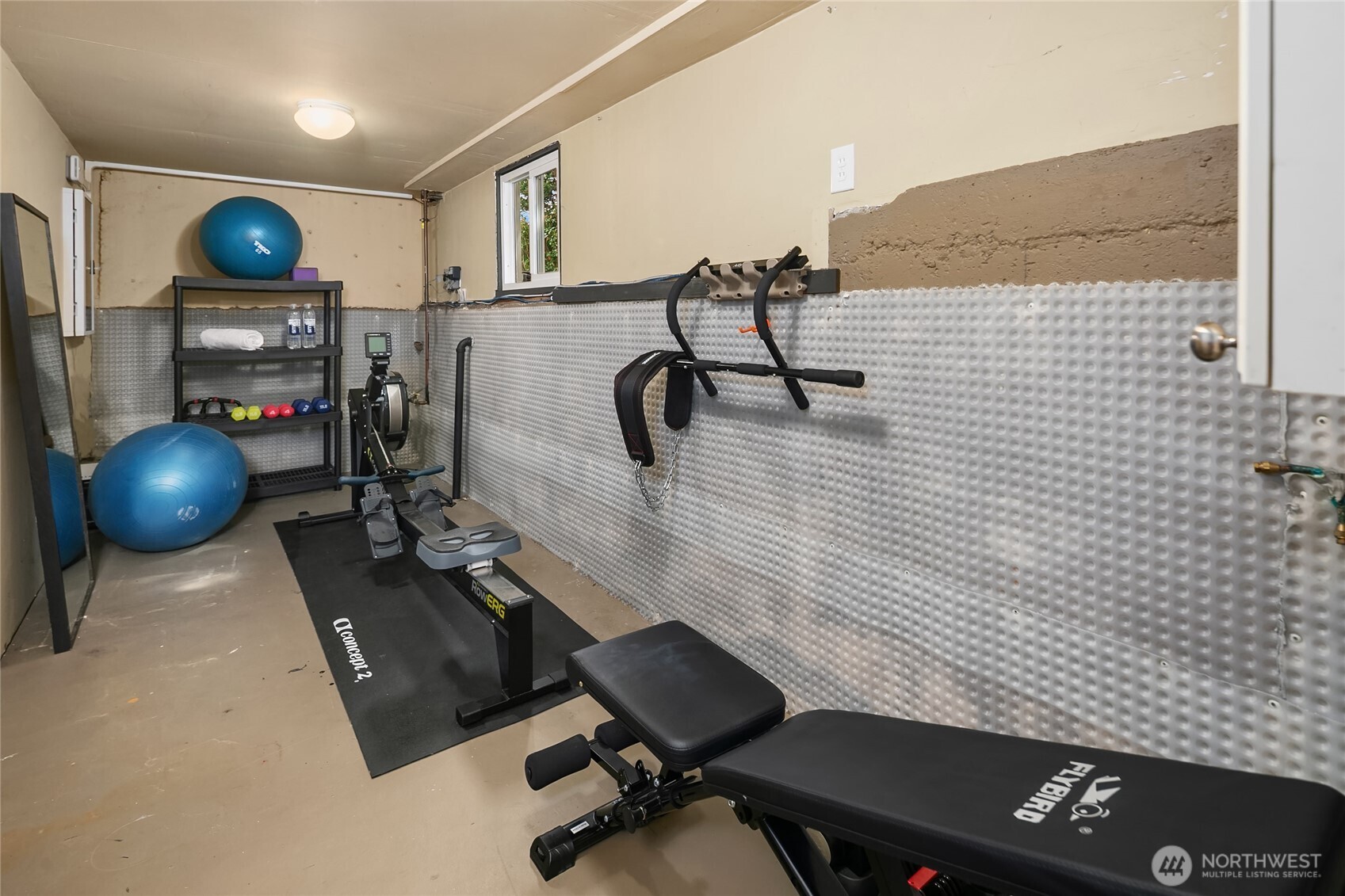 A home gym that accommodates lots of equipment.
