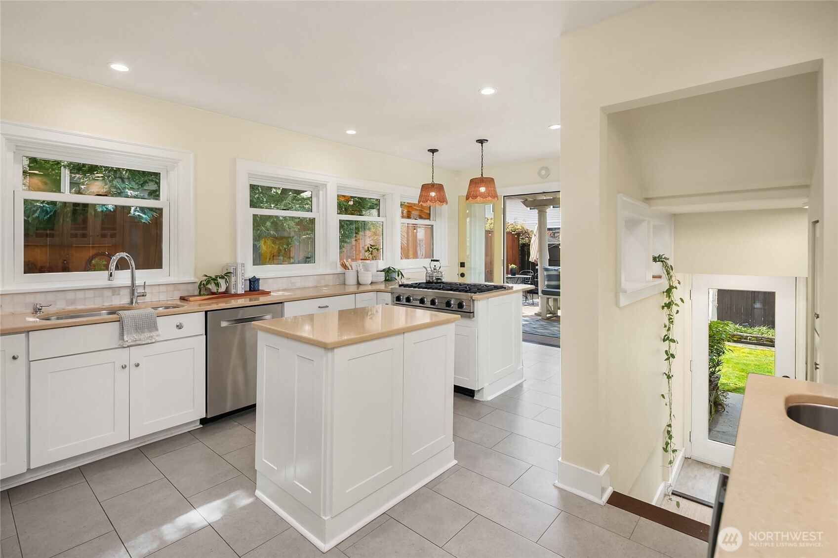 Updated kitchen has it all- Viking appliances, island, eating bar, prep station with wine/beverage refrigerator.