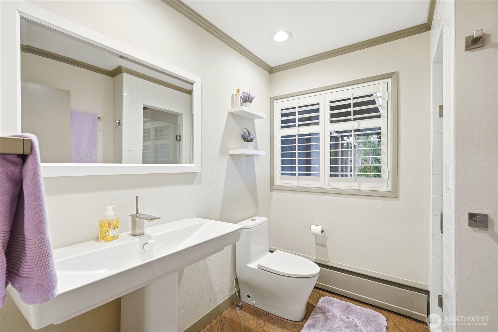 Adjacent 3/4 bathroom to view guest bedroom and functions as main floor powder bathroom.