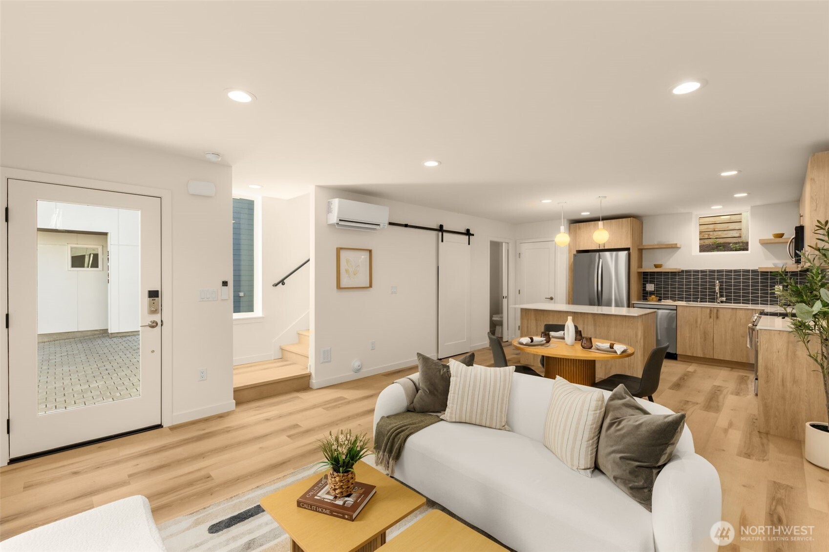 Kitchen opens to living and dining areas.