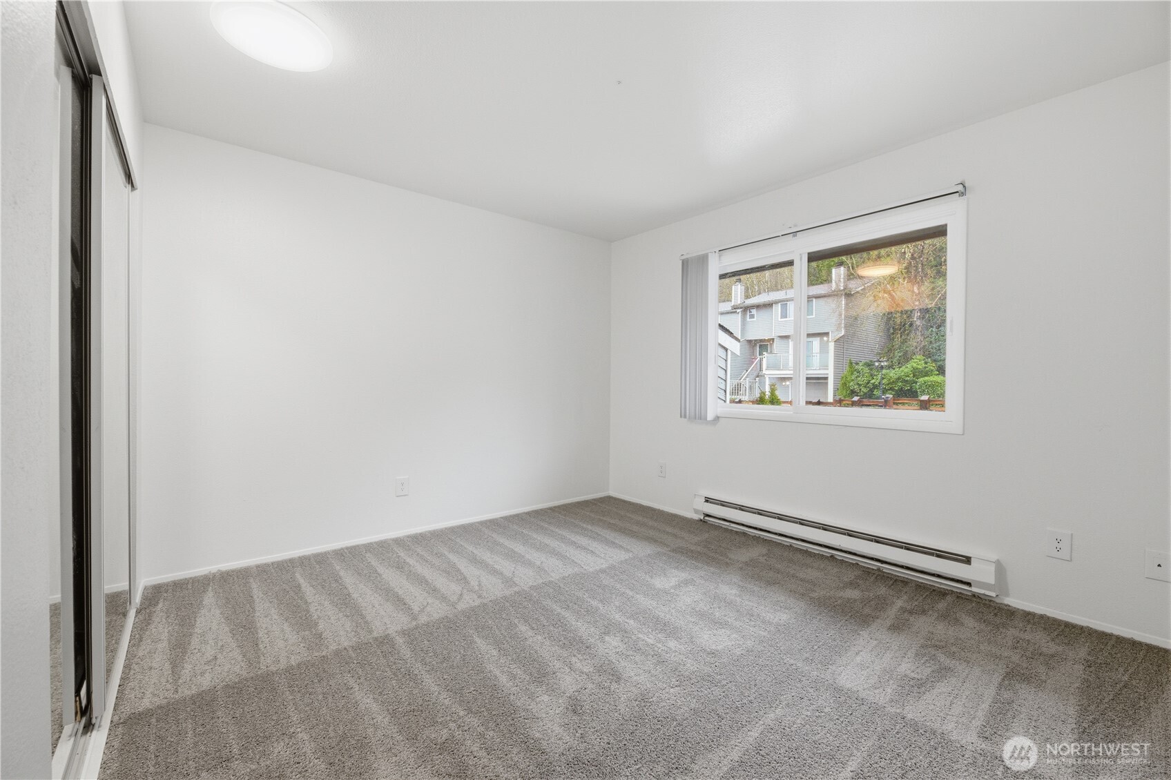 Upstairs bathroom features dual vanities, with doors to the hallway and