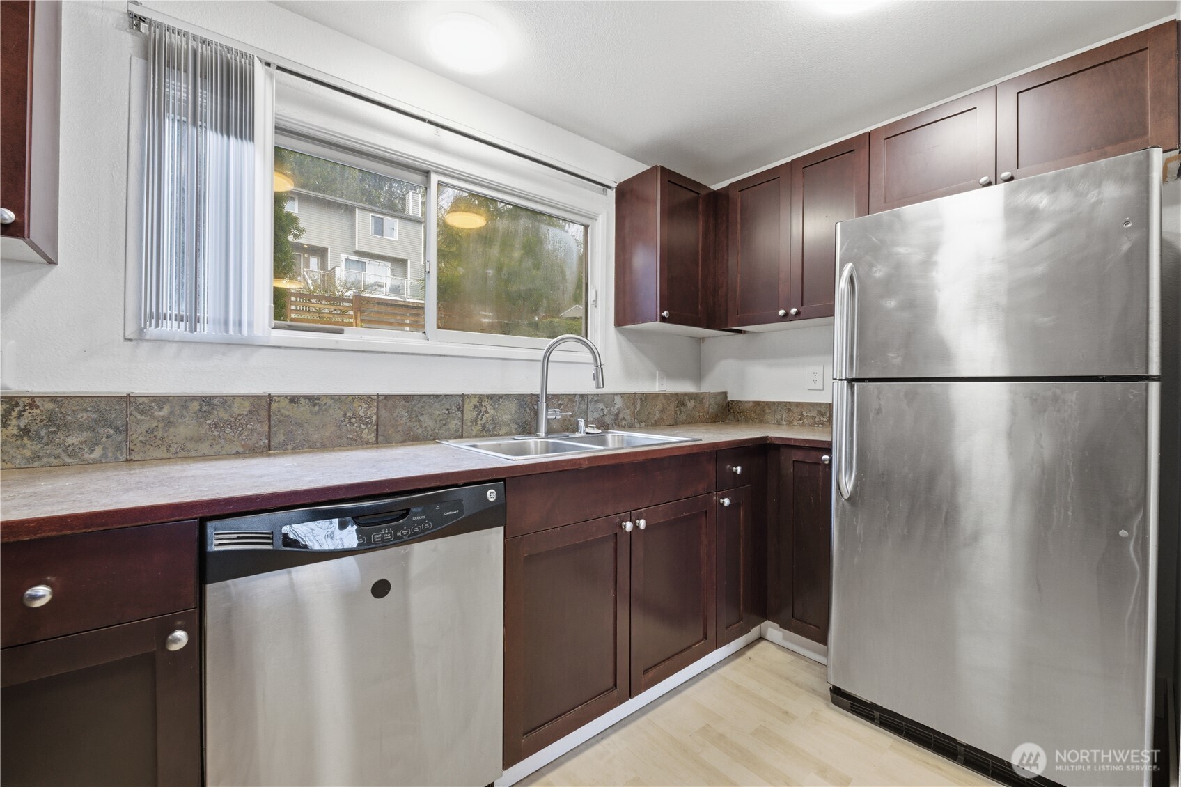 Another view of the kitchen showcasing the open floor plan.