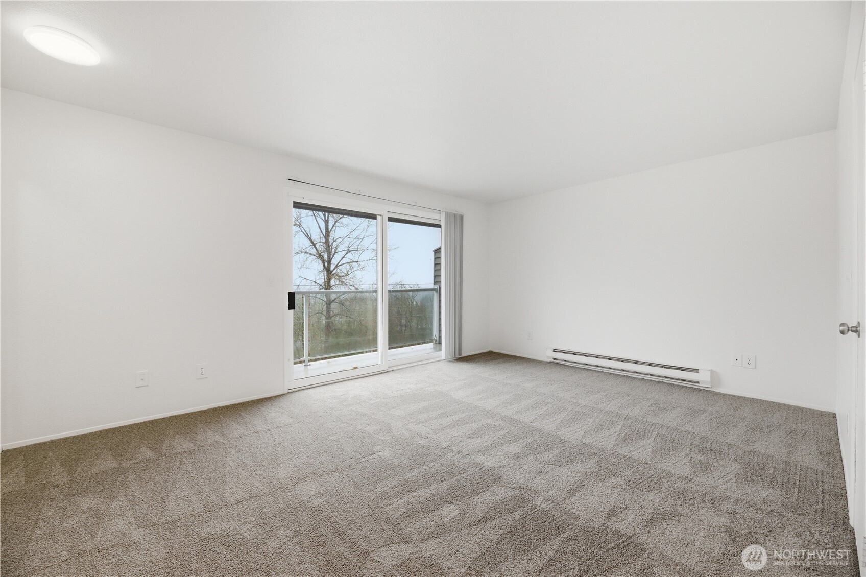 Kitchen boasts plenty of cabinet and counter space with expansive window above the sink that pours in natural light.