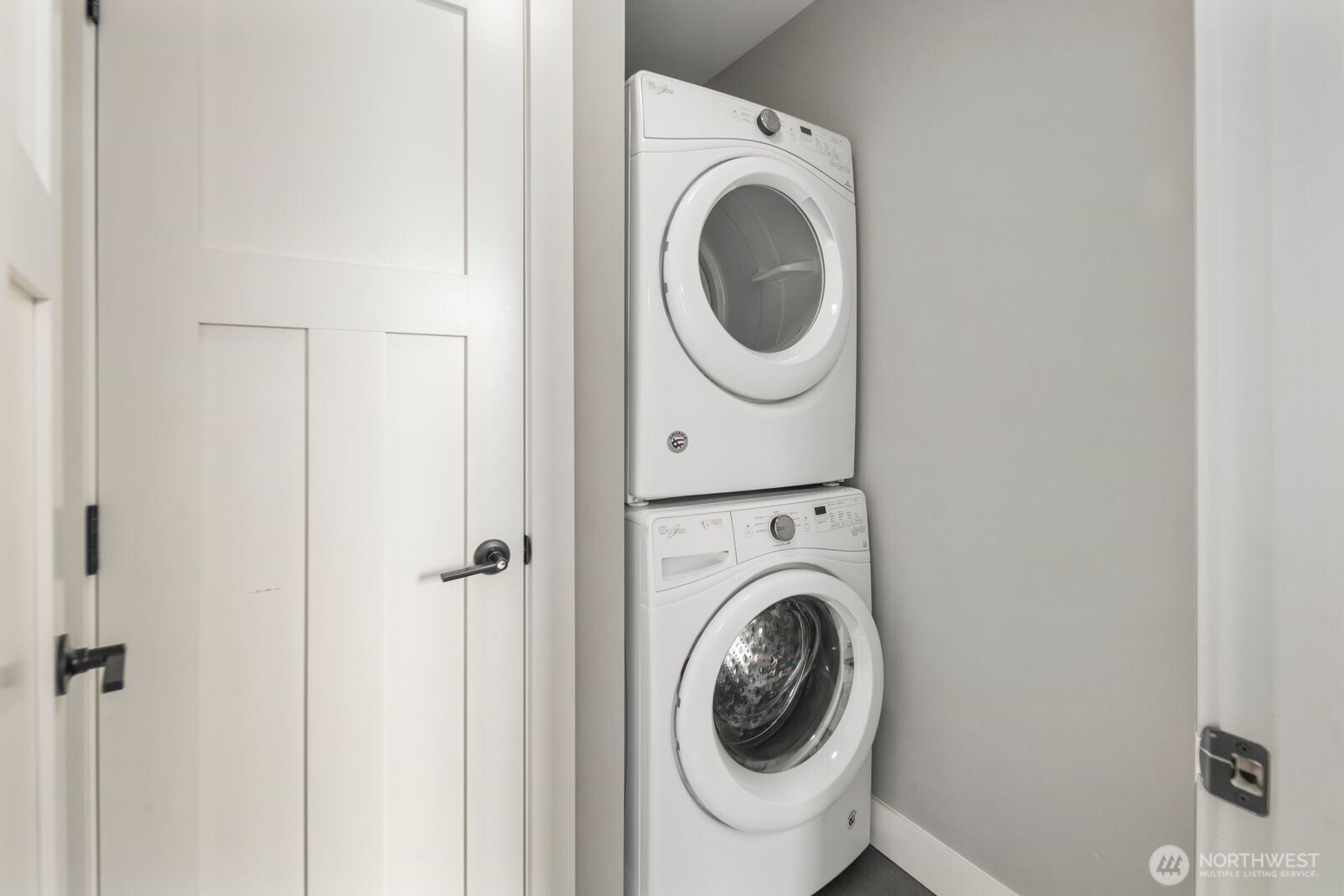 Upper level laundry room with linen closet
