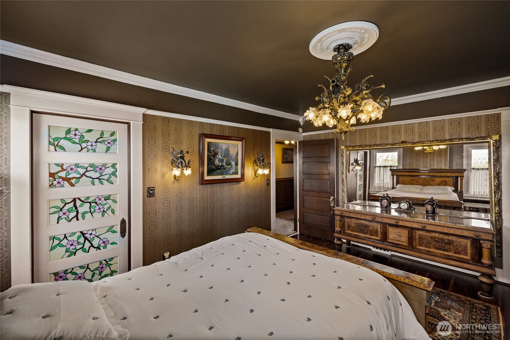 Panel glass door to the left connects to another bedroom for options.