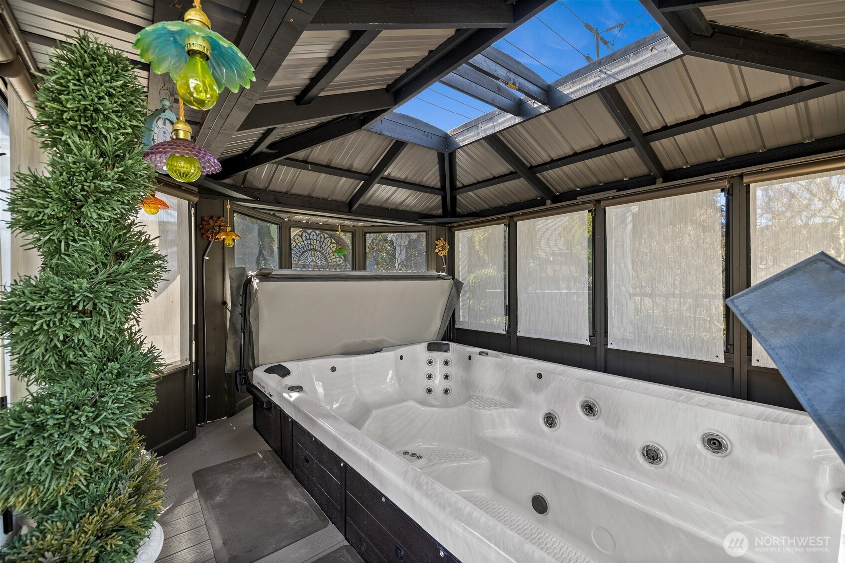 Swim spa with privacy shades & large skylight.