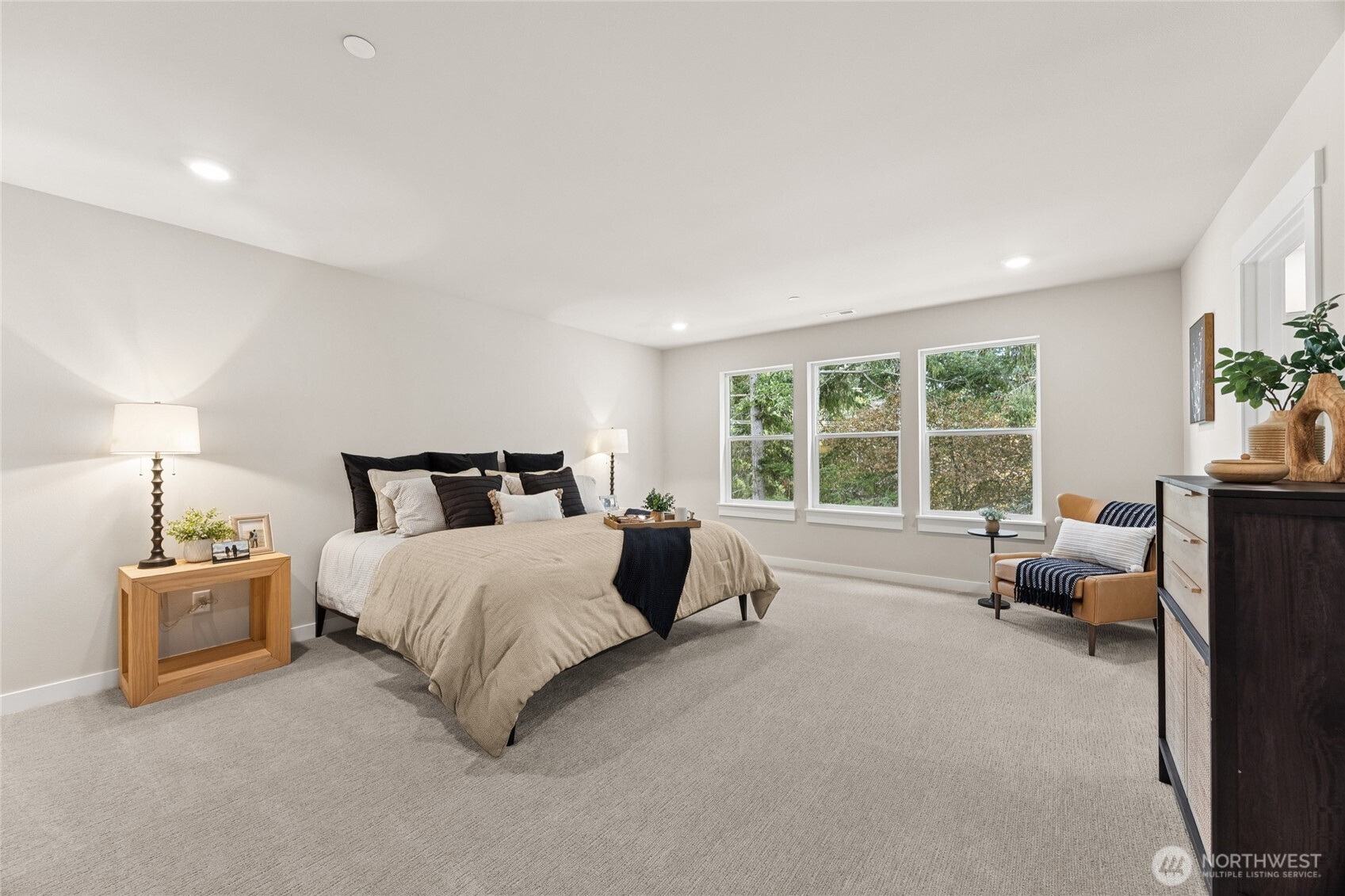 Generous primary suite with abundance of natural light and room to unwind.