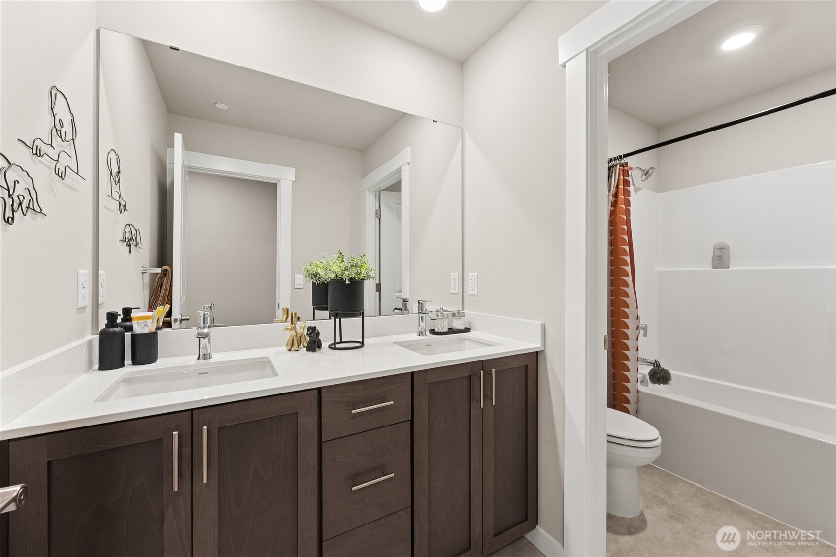 Upstairs bath, vanity with dual sinks.