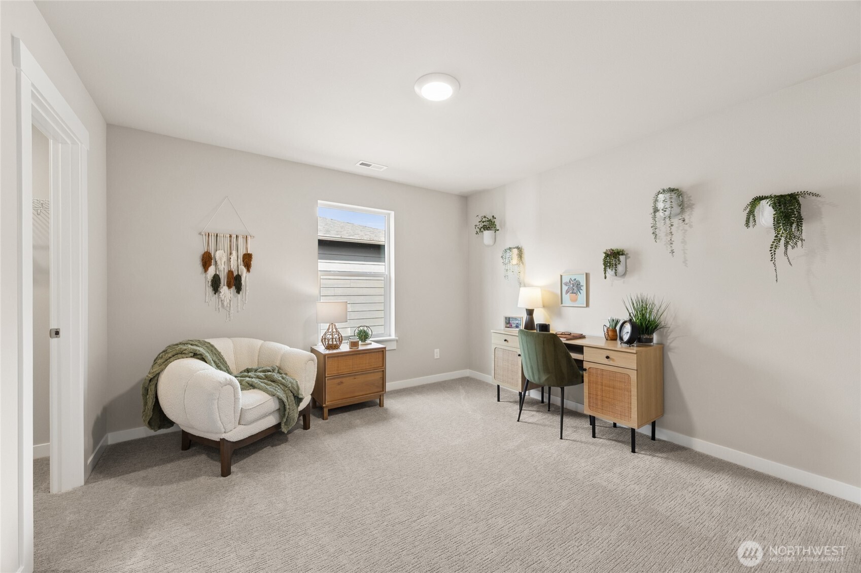 Stylish multi-use room offering a polished space for work or relaxation.