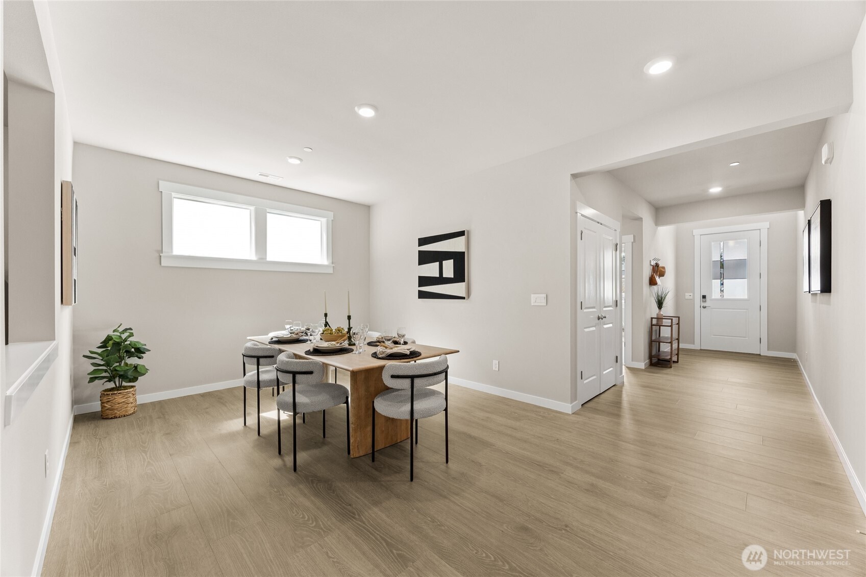 Well-lit entry, and formal dining area