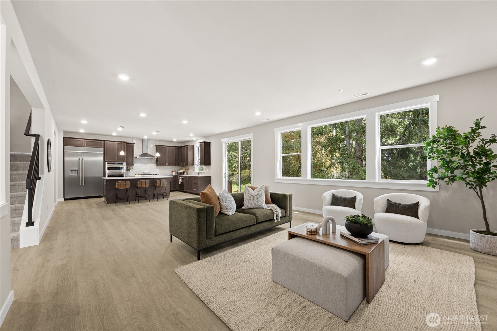 Bright and spacious great room with large windows and open layout.