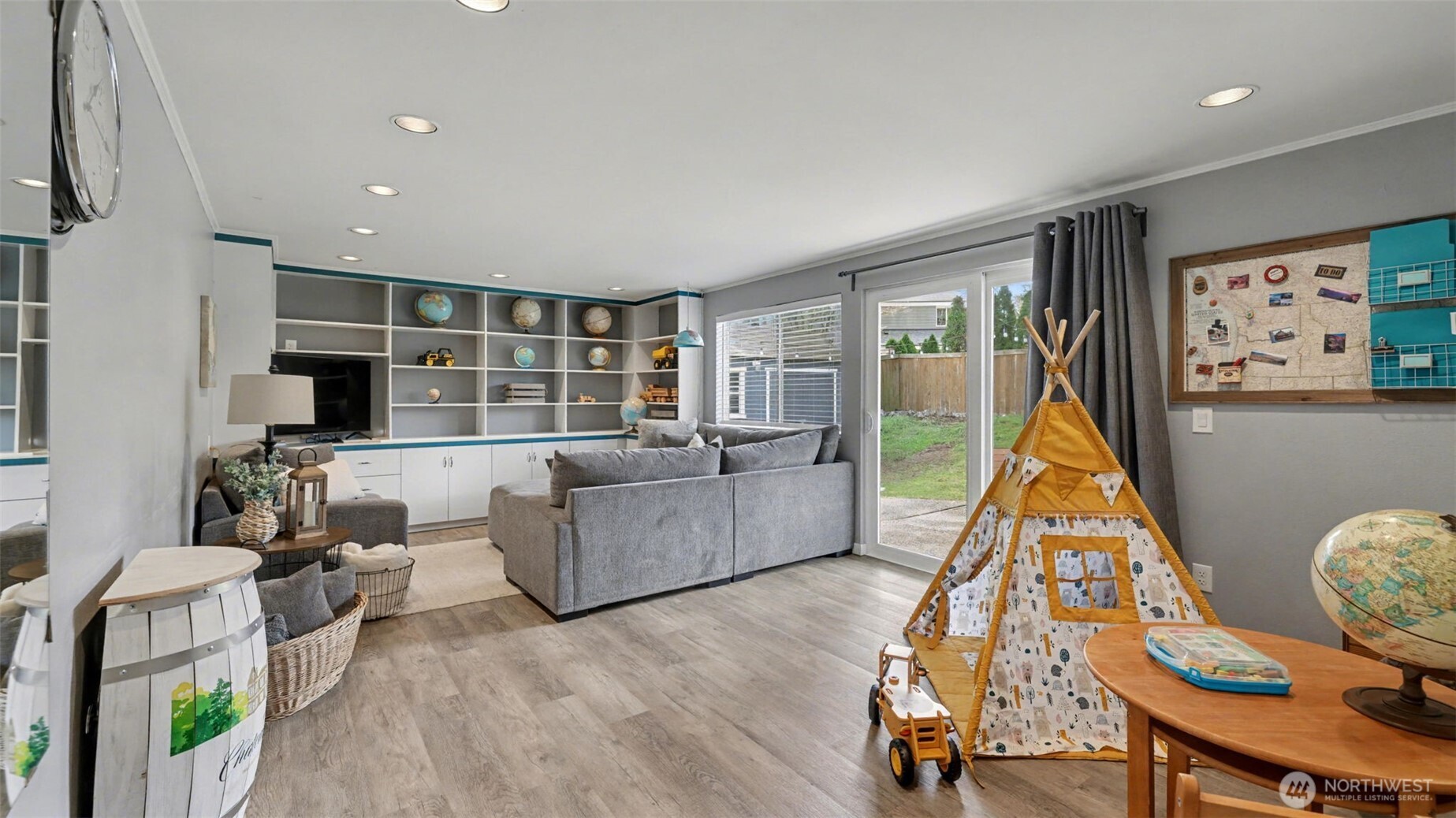 Playroom/Rec room/TV room. Sliding glass door goes out to the back patio