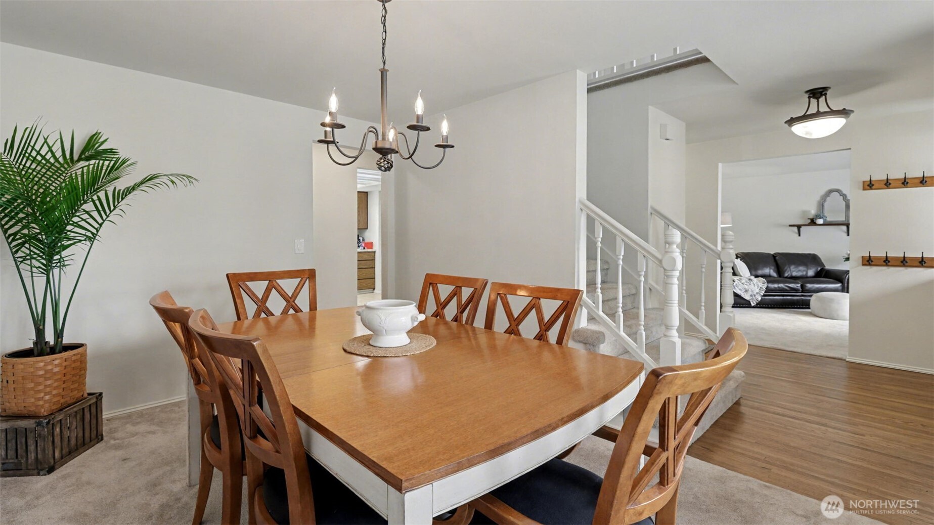 Dining room just off the entry and the living room in the background on the right