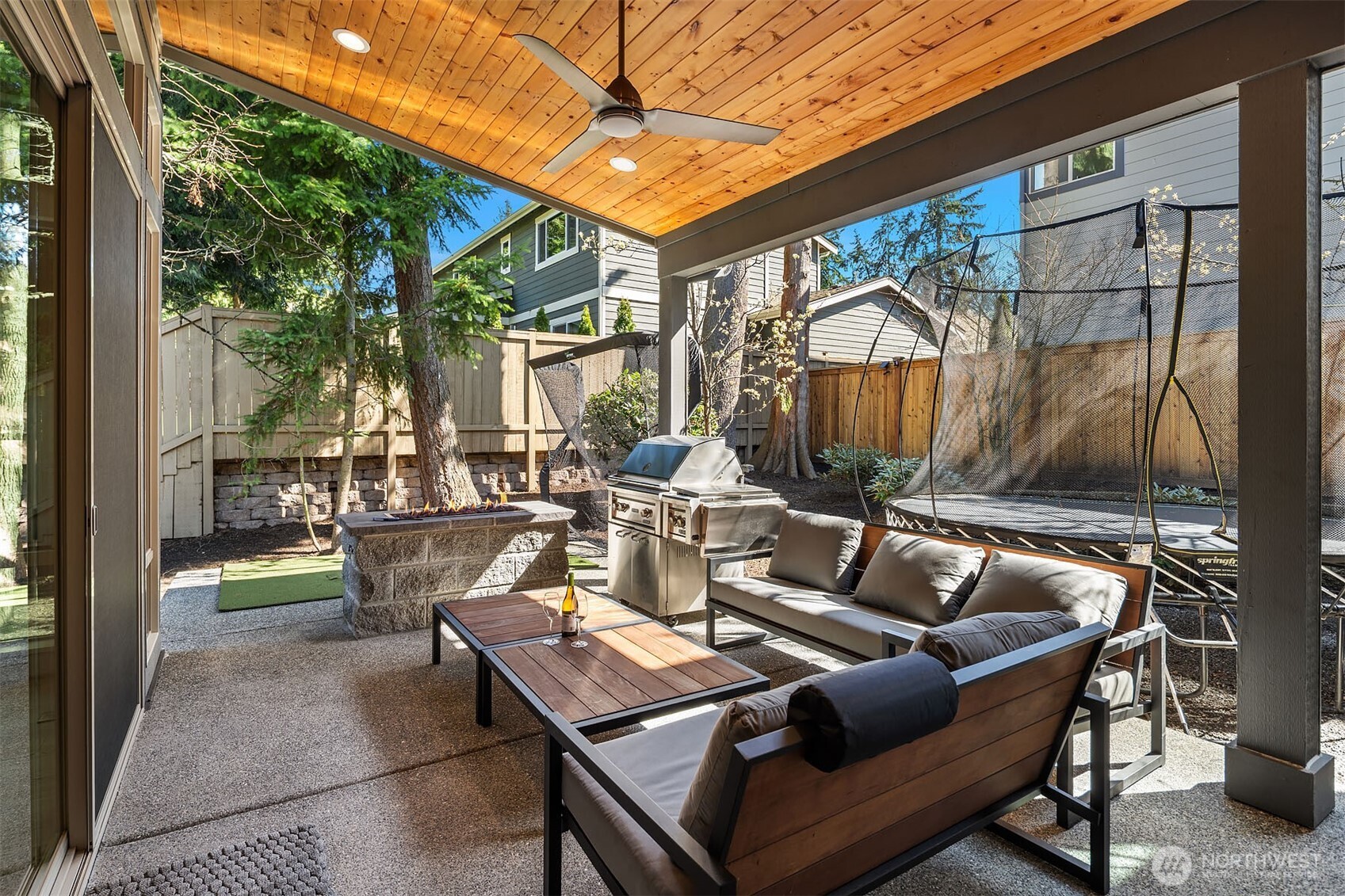 Sizable Covered Patio with Gas Fire Pit and a Heater
