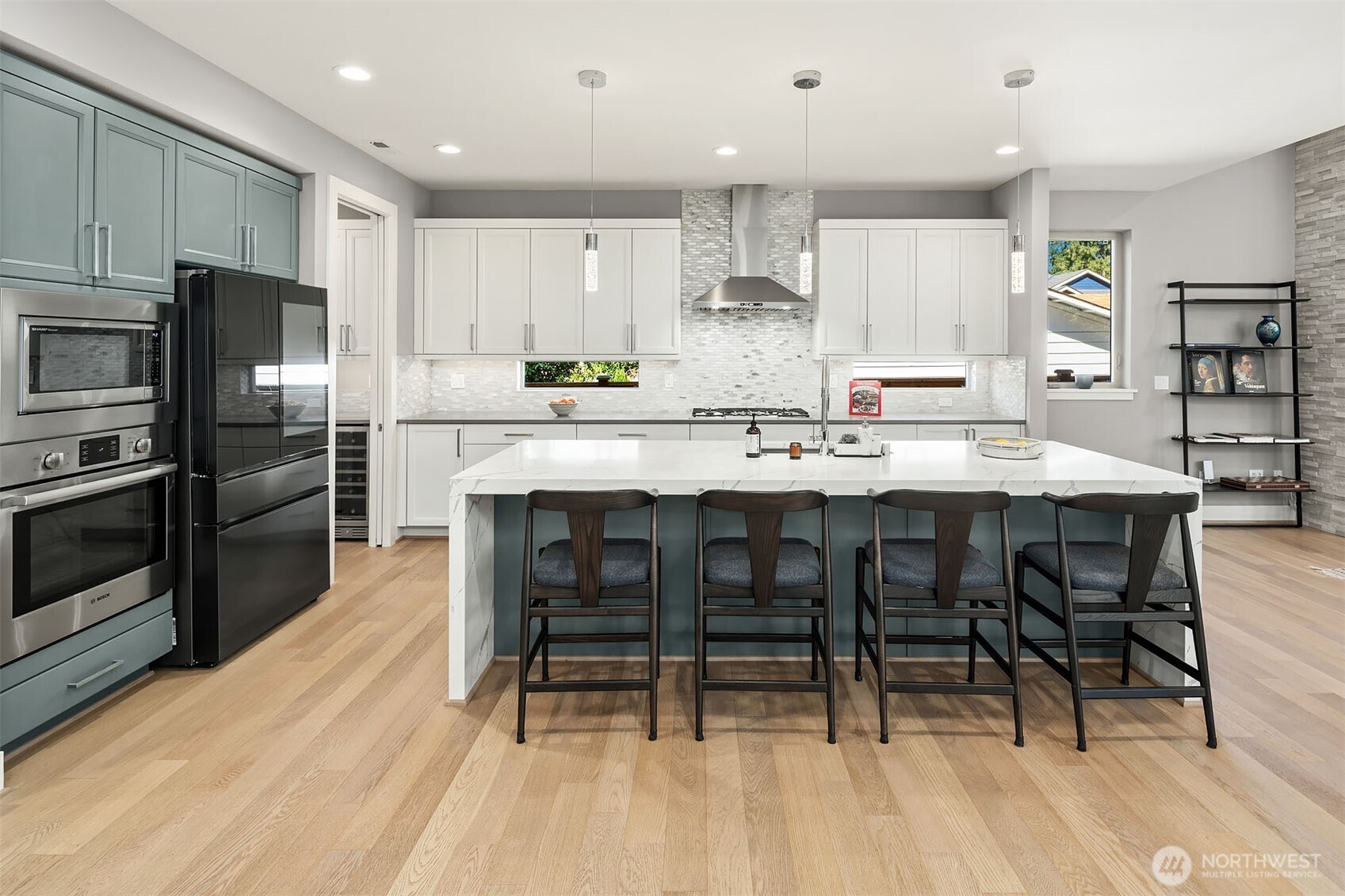 Ample high-quality Cabinets and Top-of-the-line Stainless Steel Appliances: Samsung Bespoke 4-Door Refrigerator, Bosch Dishwasher.