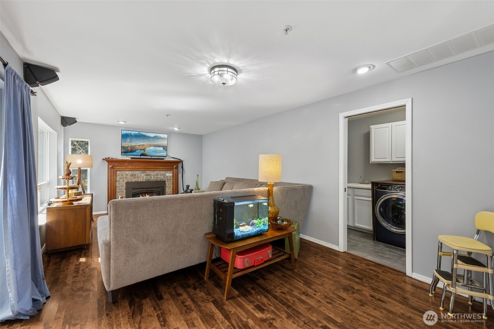 Looking from the nook toward the living room, the space feels airy, inviting, and ideal for everyday living or entertaining.