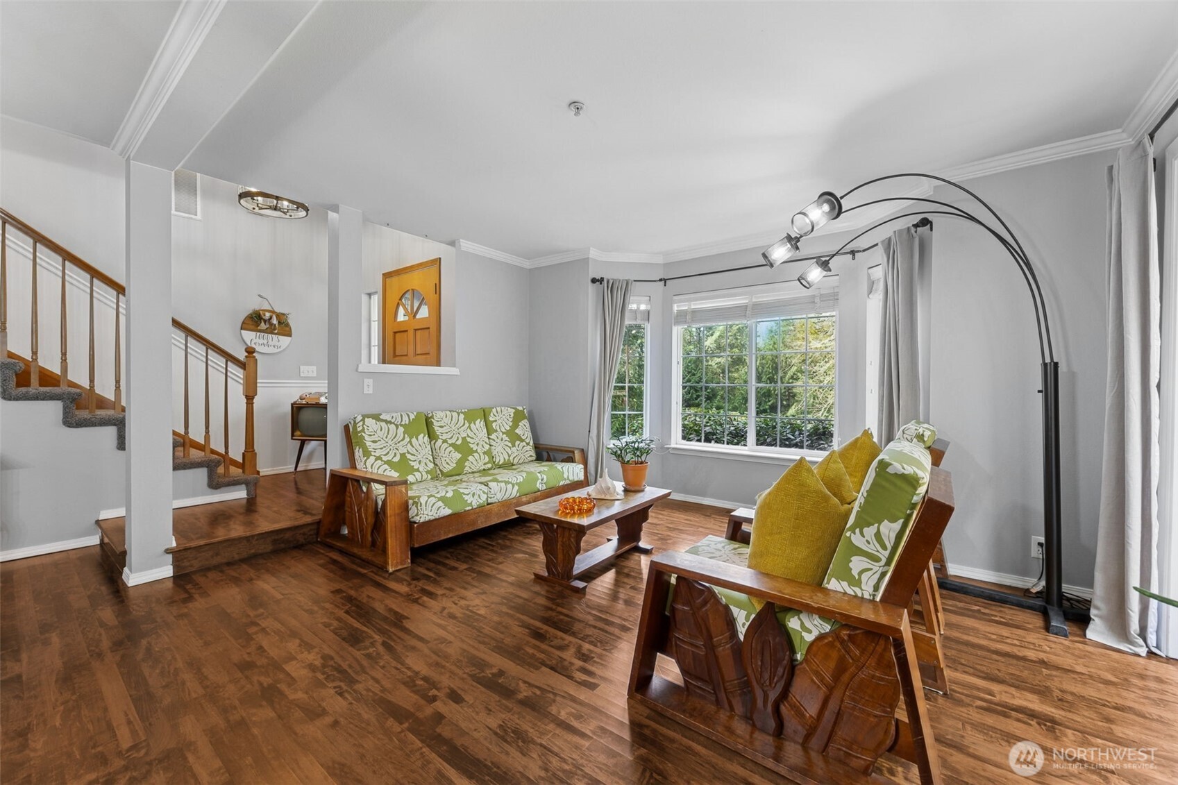 A bright and relaxing lounge space filled with natural light and designed for comfort.