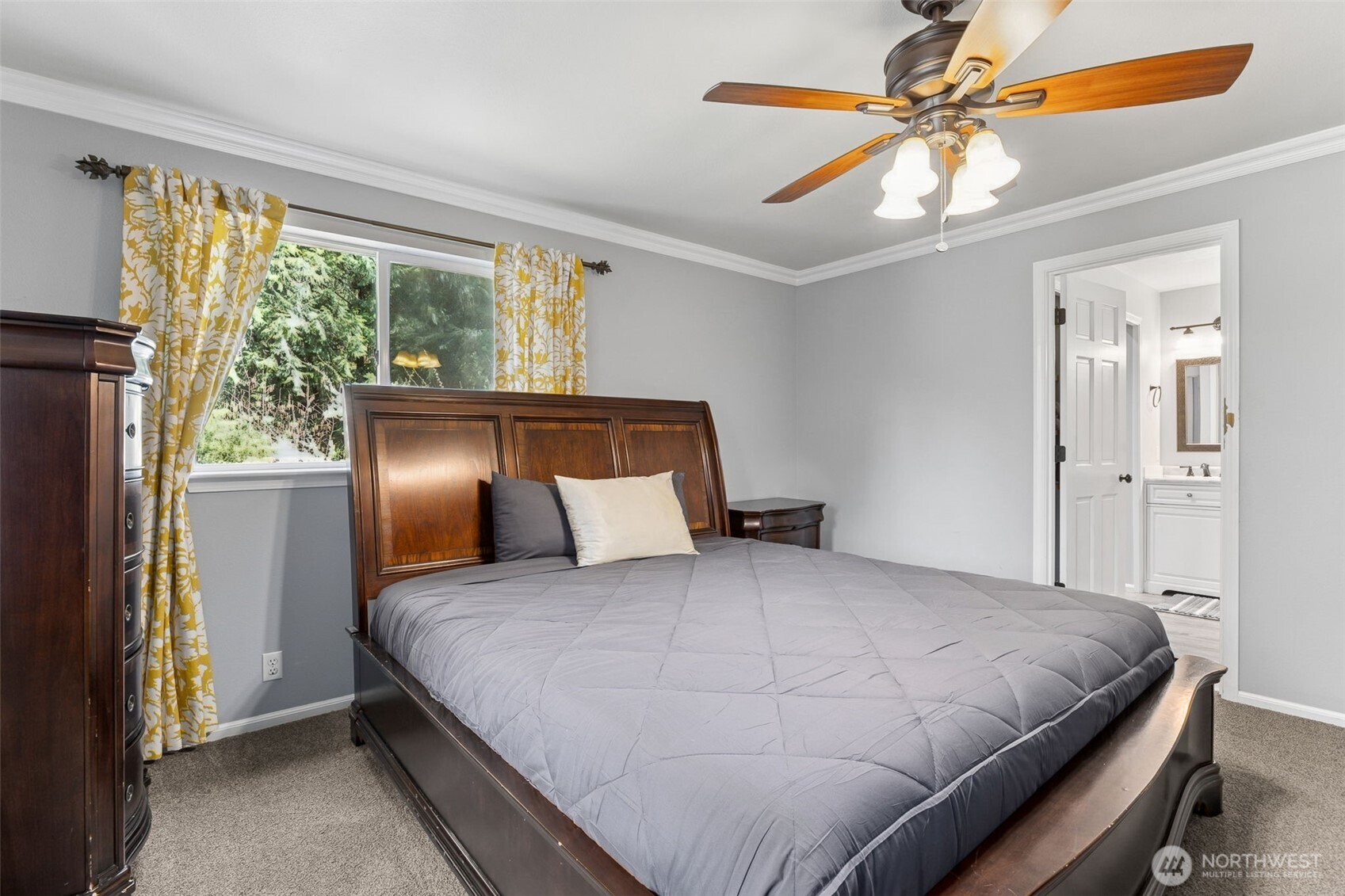 The primary bedroom offers a peaceful escape with a luxurious en-suite bathroom for ultimate comfort and convenience.