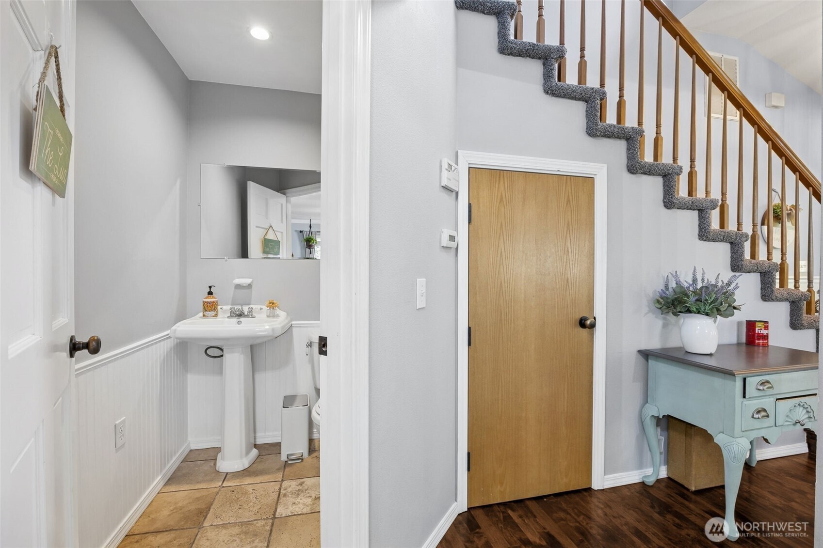Main-level powder room adds convenience for guests and everyday living.