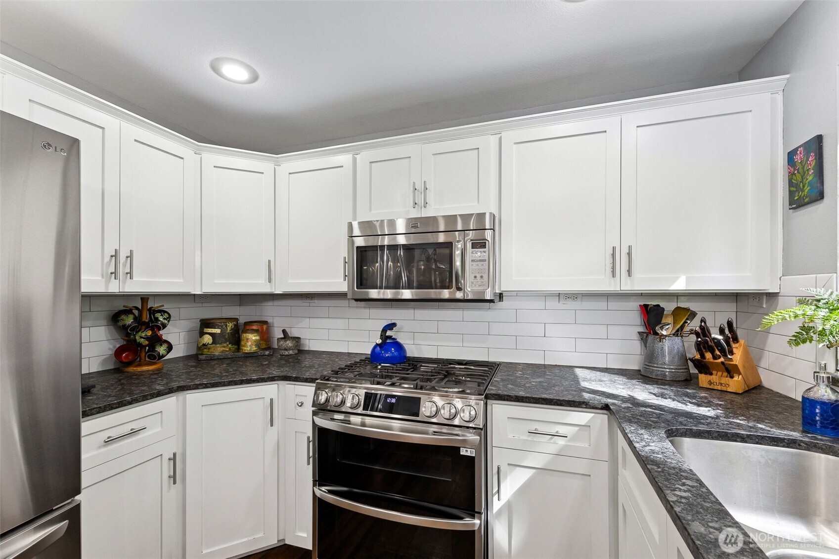 Bright and functional, the kitchen offers generous prep space with an easy connection to the nook and welcoming living room.