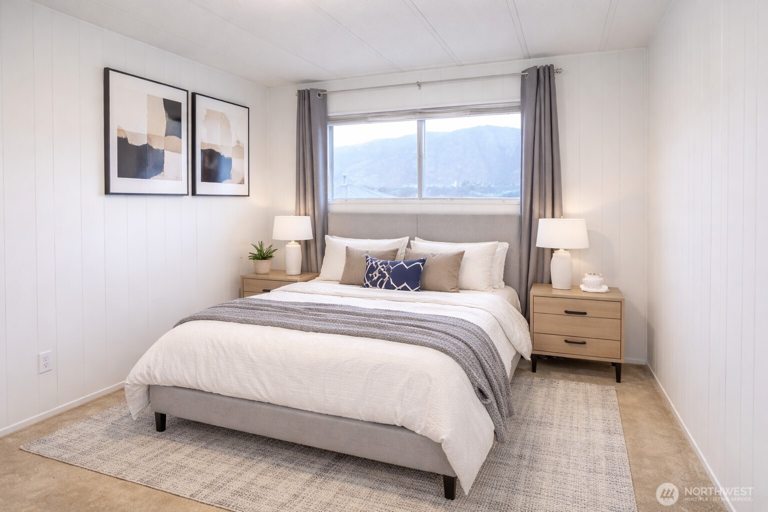 Bedroom three features beautiful lake views, carpeting, and an abundance of natural light throughout. A queen size bed fits perfectly here. with ample closet. VIRTUALLY STAGED