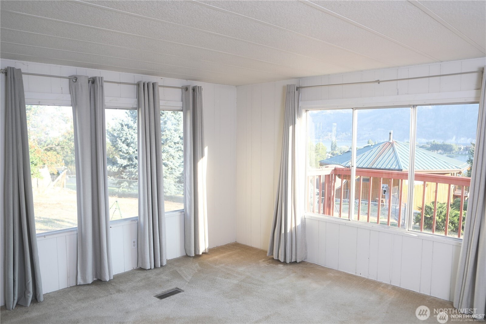 The dining room transitions smoothly into the spacious living area, enhancing the open-concept layout and natural light.