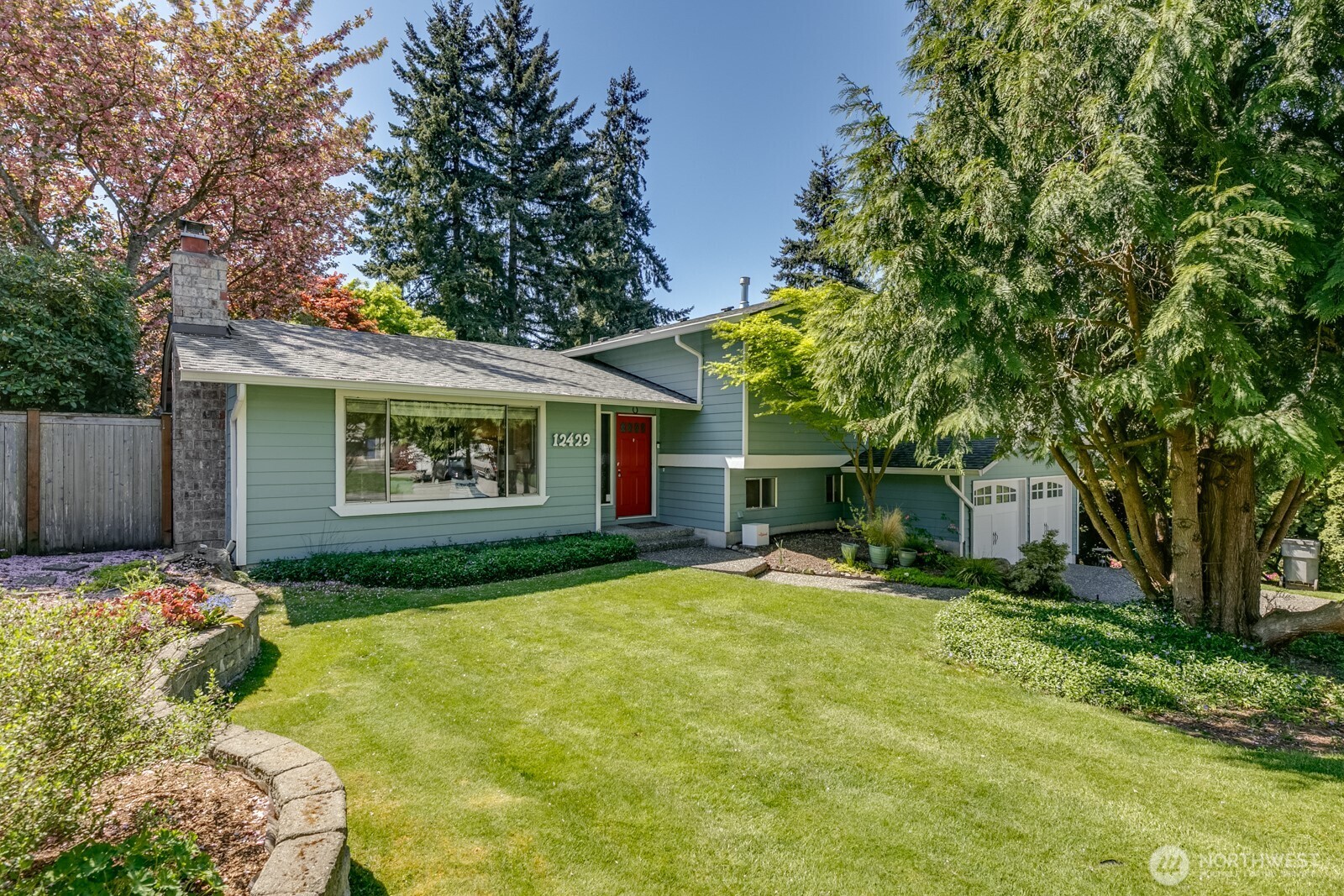 The home sits back from the road with a nice level front yard.