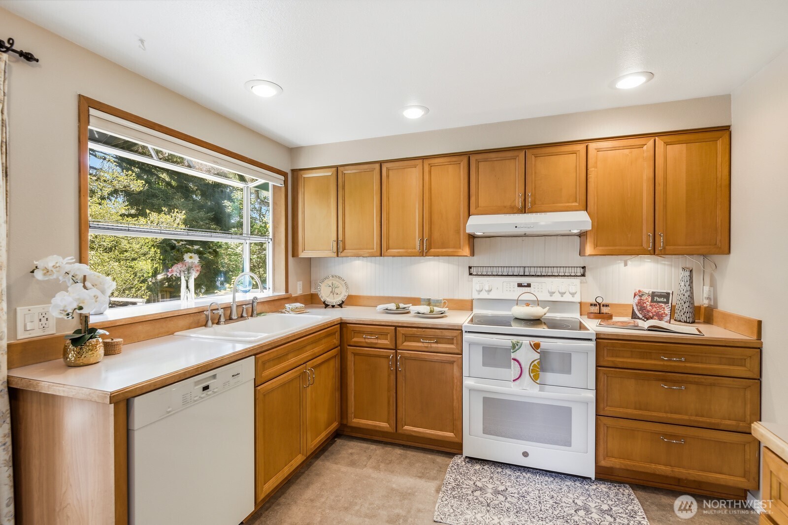 Enjoy the back yard view while doing dishes or prepping meals.