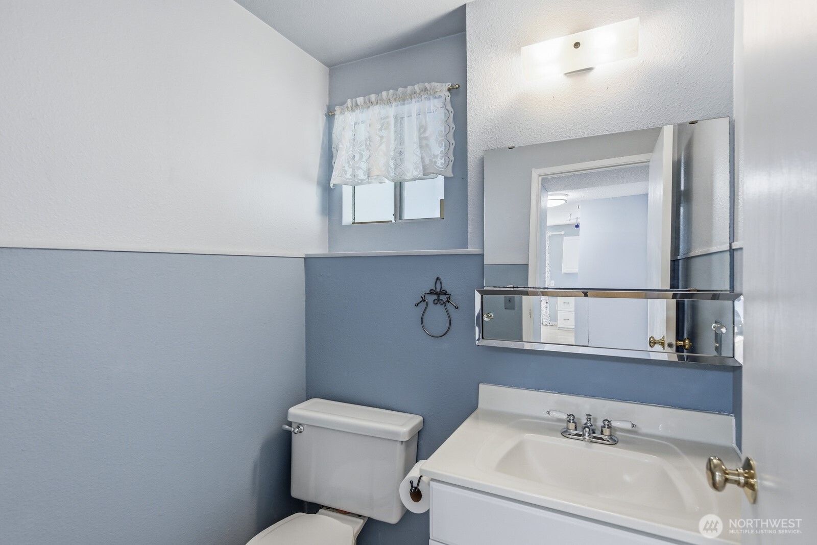 Off of the family room is the powder room.