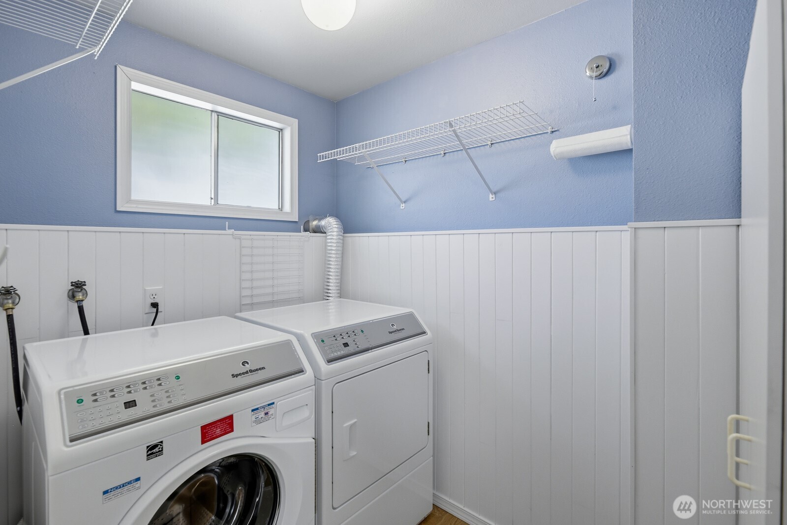 Light & bright full size utility room.
