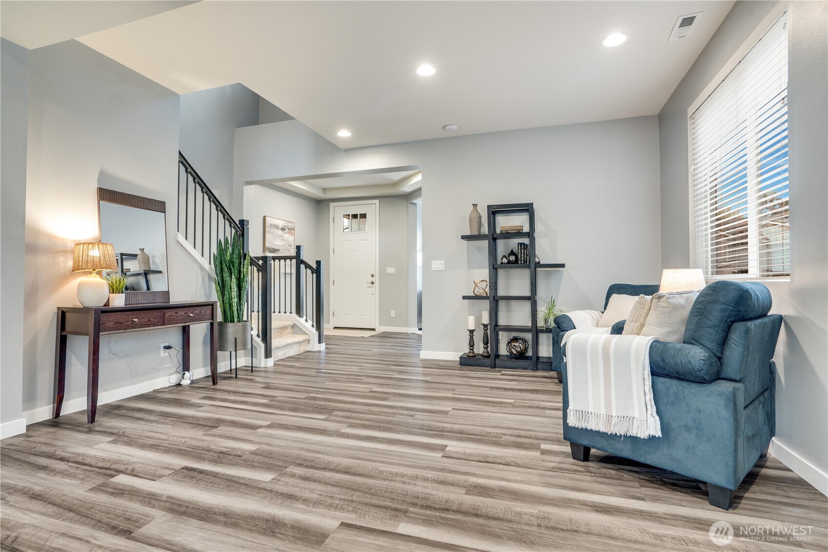To the right of the front door is the office and half bath.