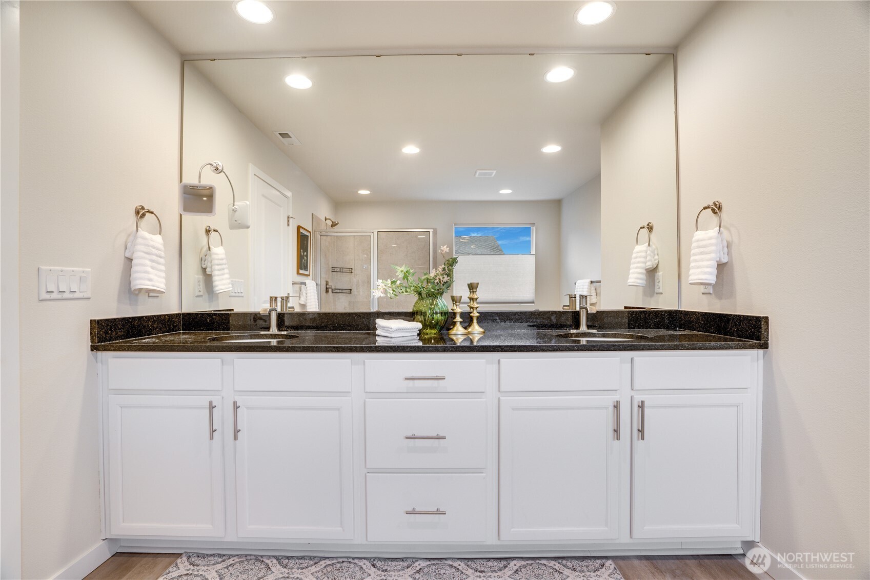 Dual vanity sink, solid stone countertops great storage space and lighting