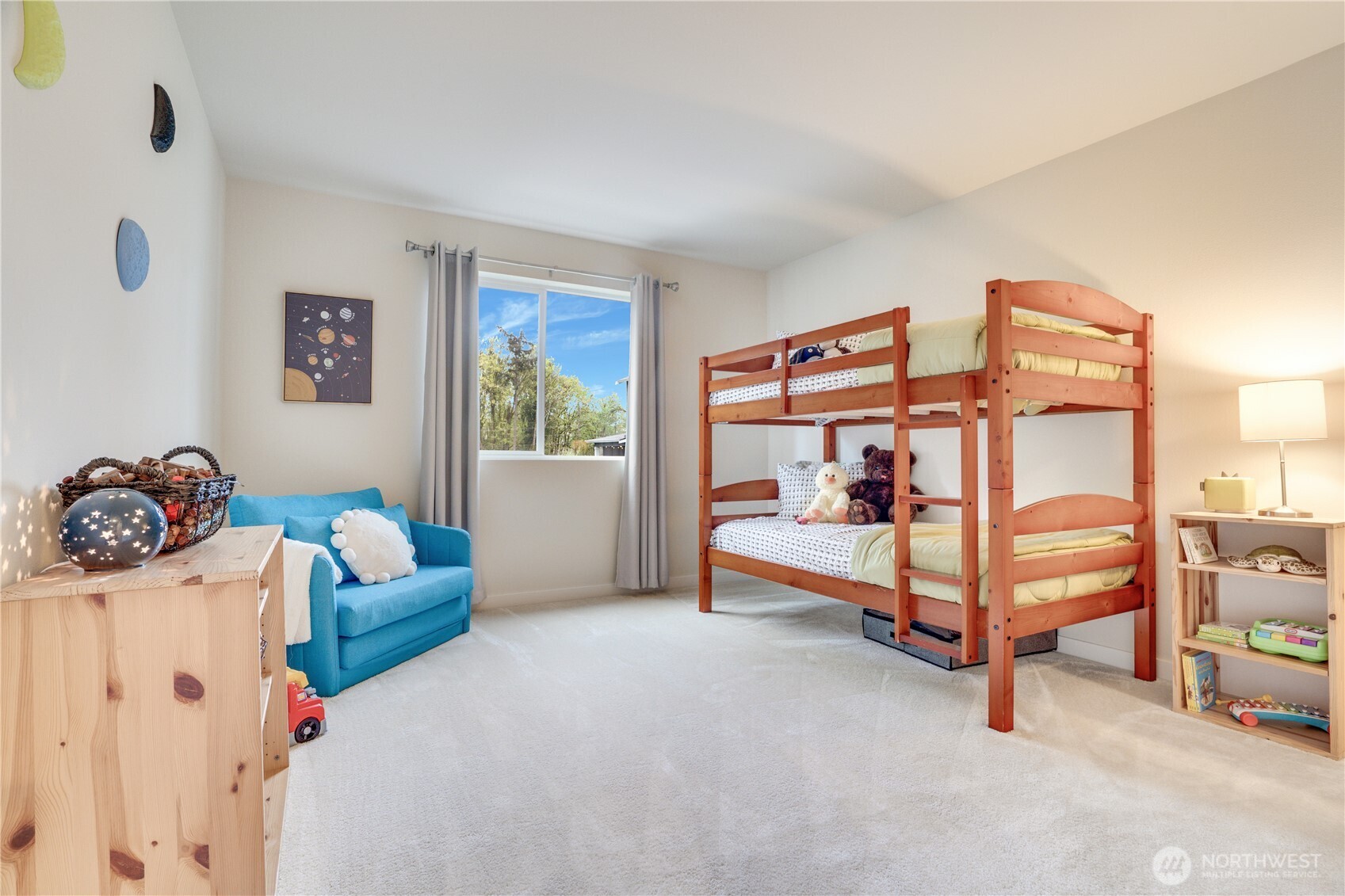 2nd bedroom upstairs overlooking the green space behind the property.