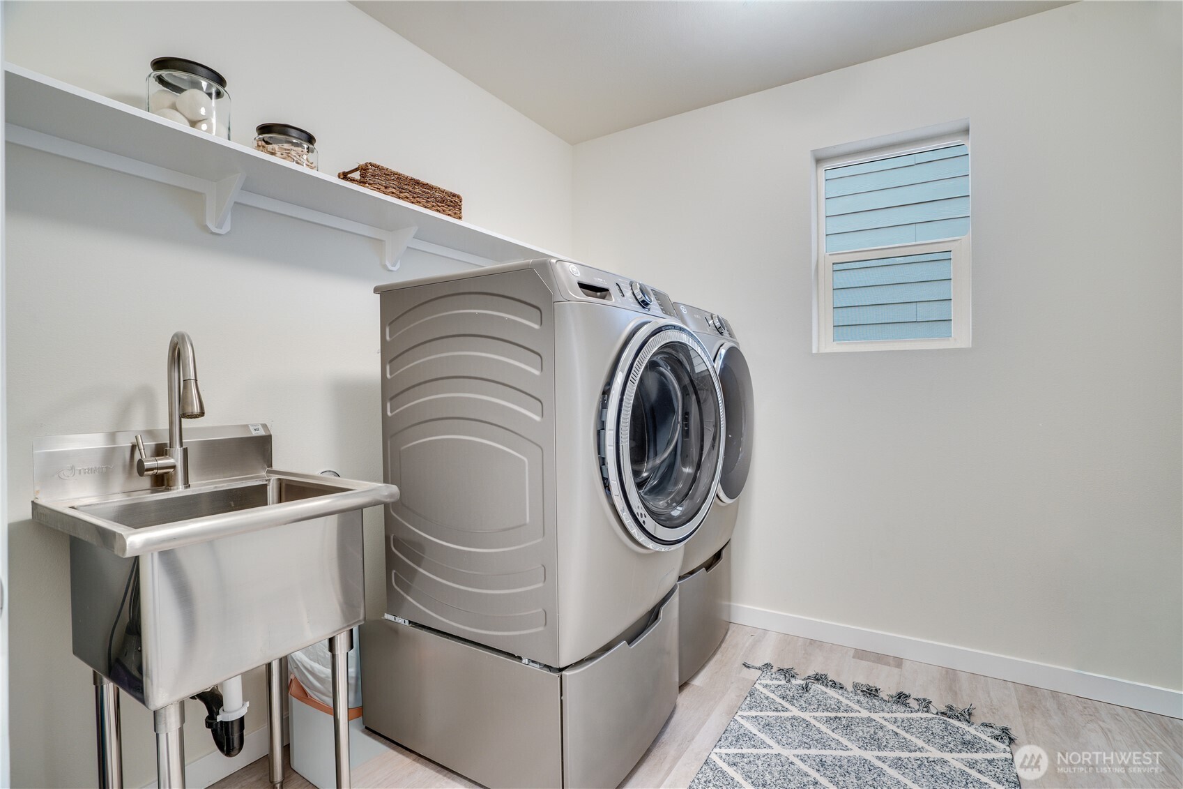 Laundry room upstairs with handy utility sink