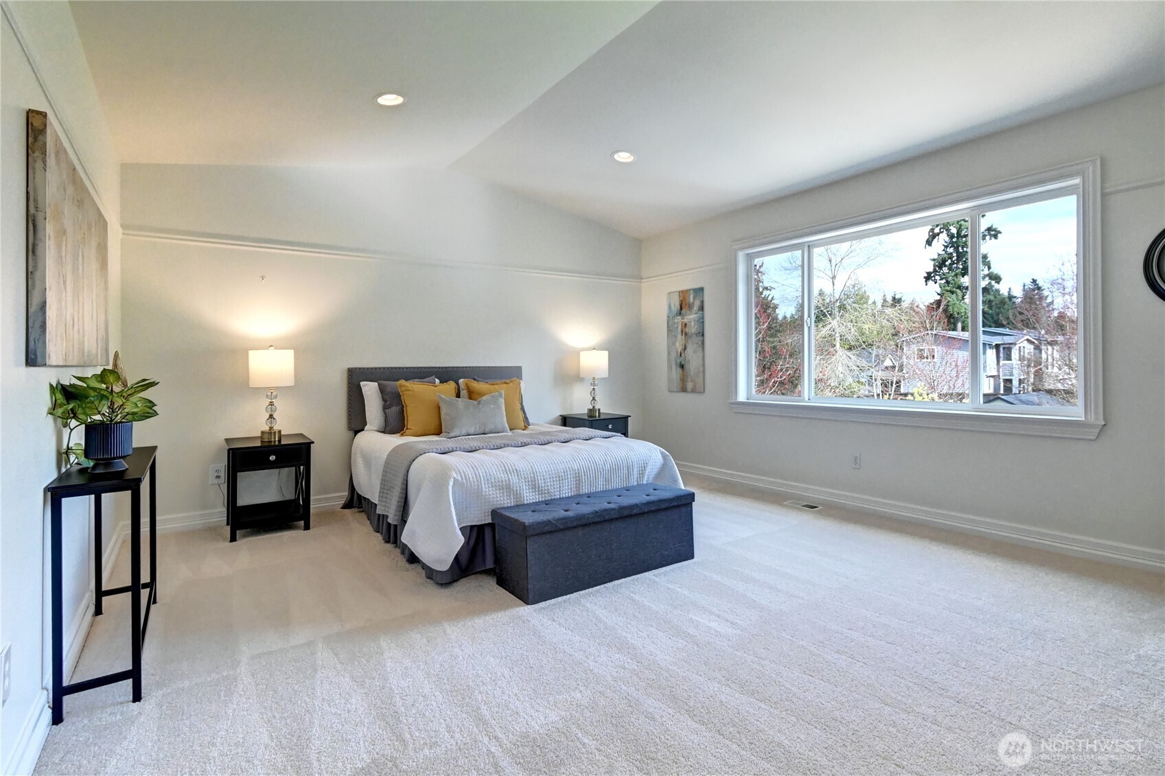 Large Primary Suite features Eastern view windows & lots of light.