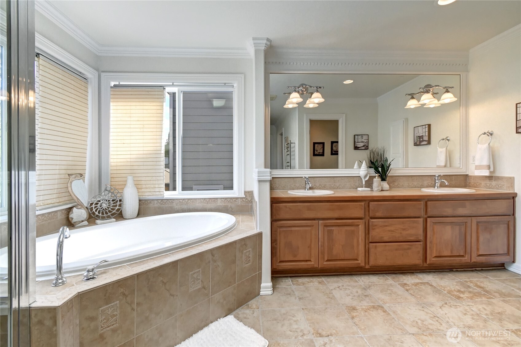 Beautiful Master Bath with tile flooring and oversized soaking tub, heated towel rack & bidet.